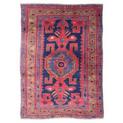 Antique Caucasian Kazak Rug with Bold Geometric Tribal Medallion Design