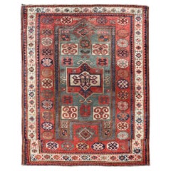 Antique Caucasian Kazak Rug with Brick Red Field and Bold Tribal Medallions