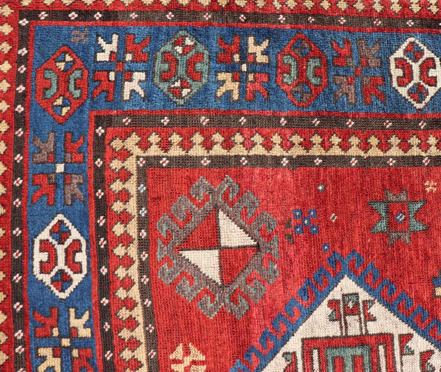 Measures: 5'2 x 9'1 
Antique Caucasian Kazak Rug with Four Bold Medallions on Red Field 5'2 x 9'1 . Keivan Woven Arts/ rug/X23-1105, country of origin / type: Caucasus / Kazak, circa 1880.

This antique Caucasian Kazak rug features a striking design