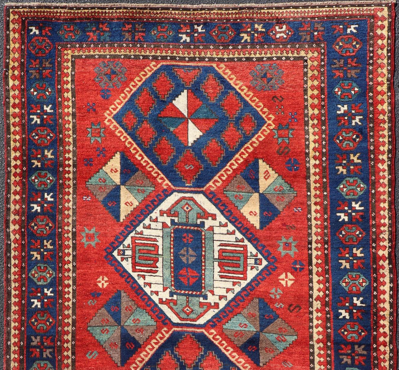 Armenian Antique Caucasian Kazak Rug with Four Bold Medallions on Red Field 5'2 x 9'1 For Sale