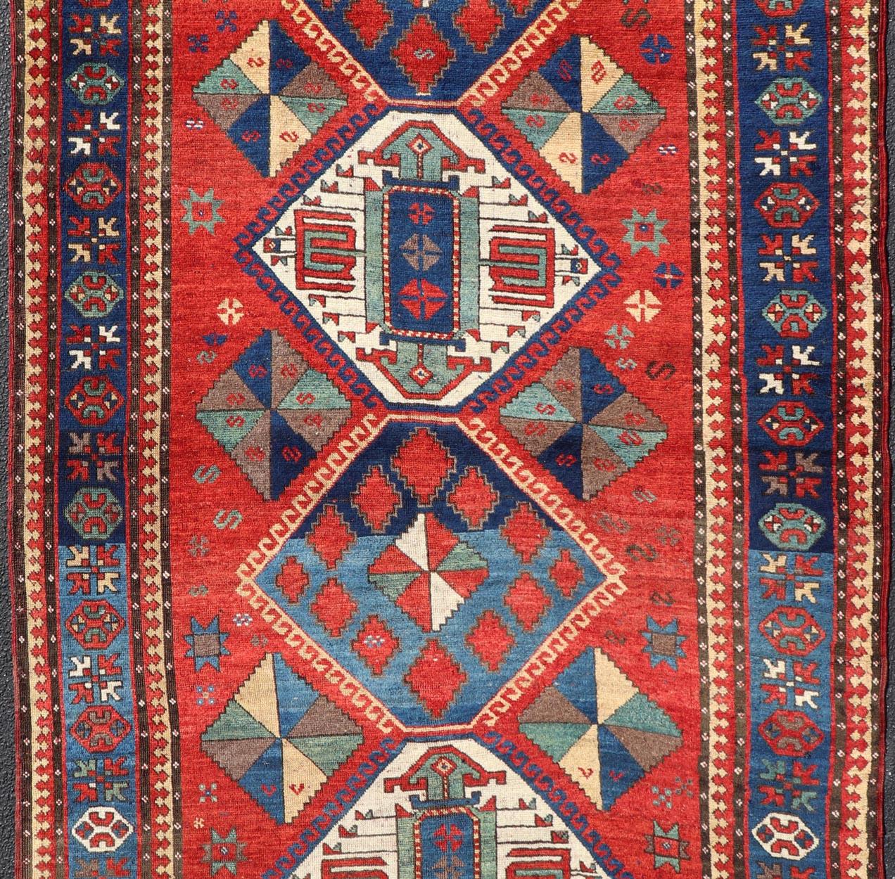 Hand-Knotted Antique Caucasian Kazak Rug with Four Bold Medallions on Red Field 5'2 x 9'1 For Sale