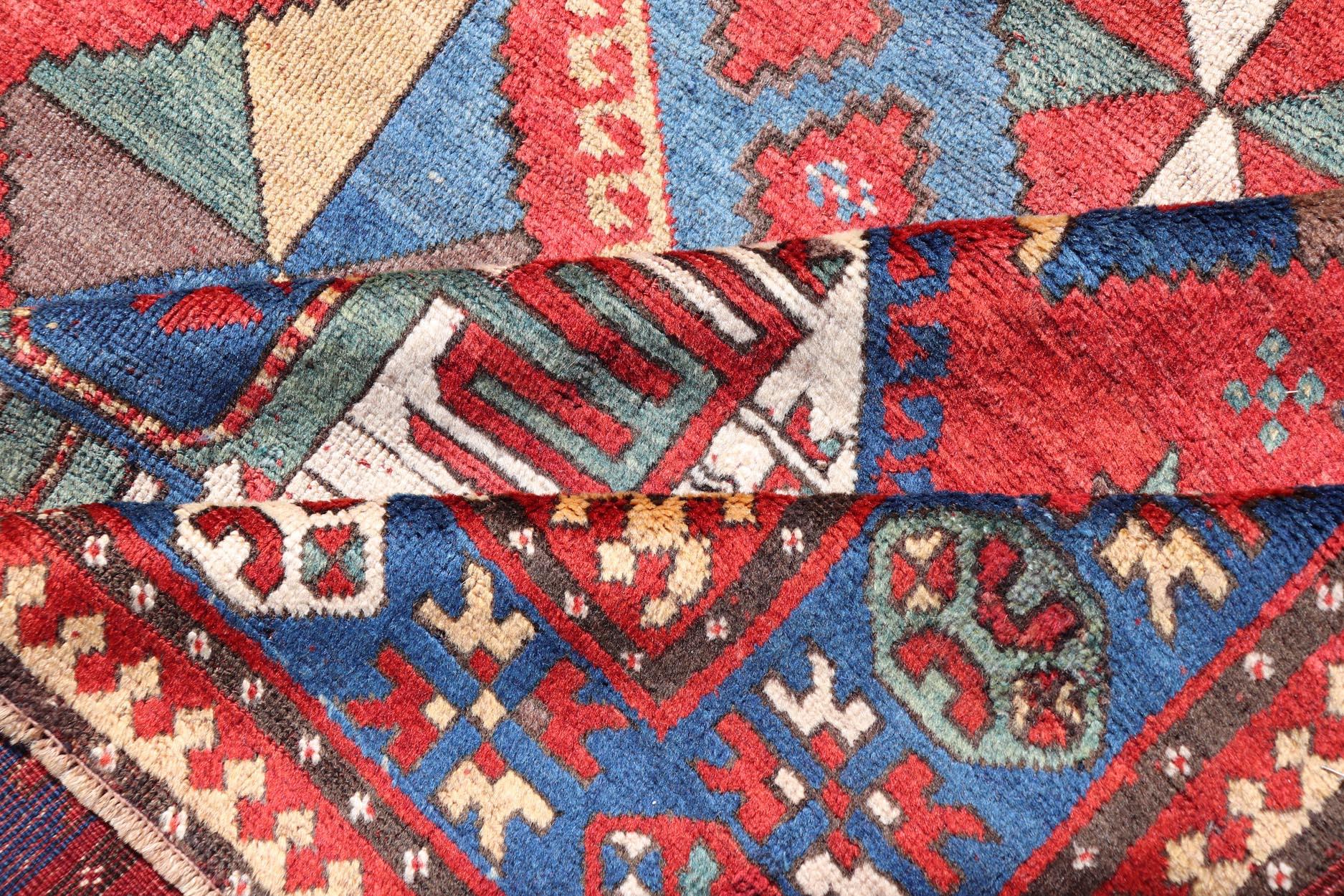 Wool Antique Caucasian Kazak Rug with Four Bold Medallions on Red Field 5'2 x 9'1 For Sale