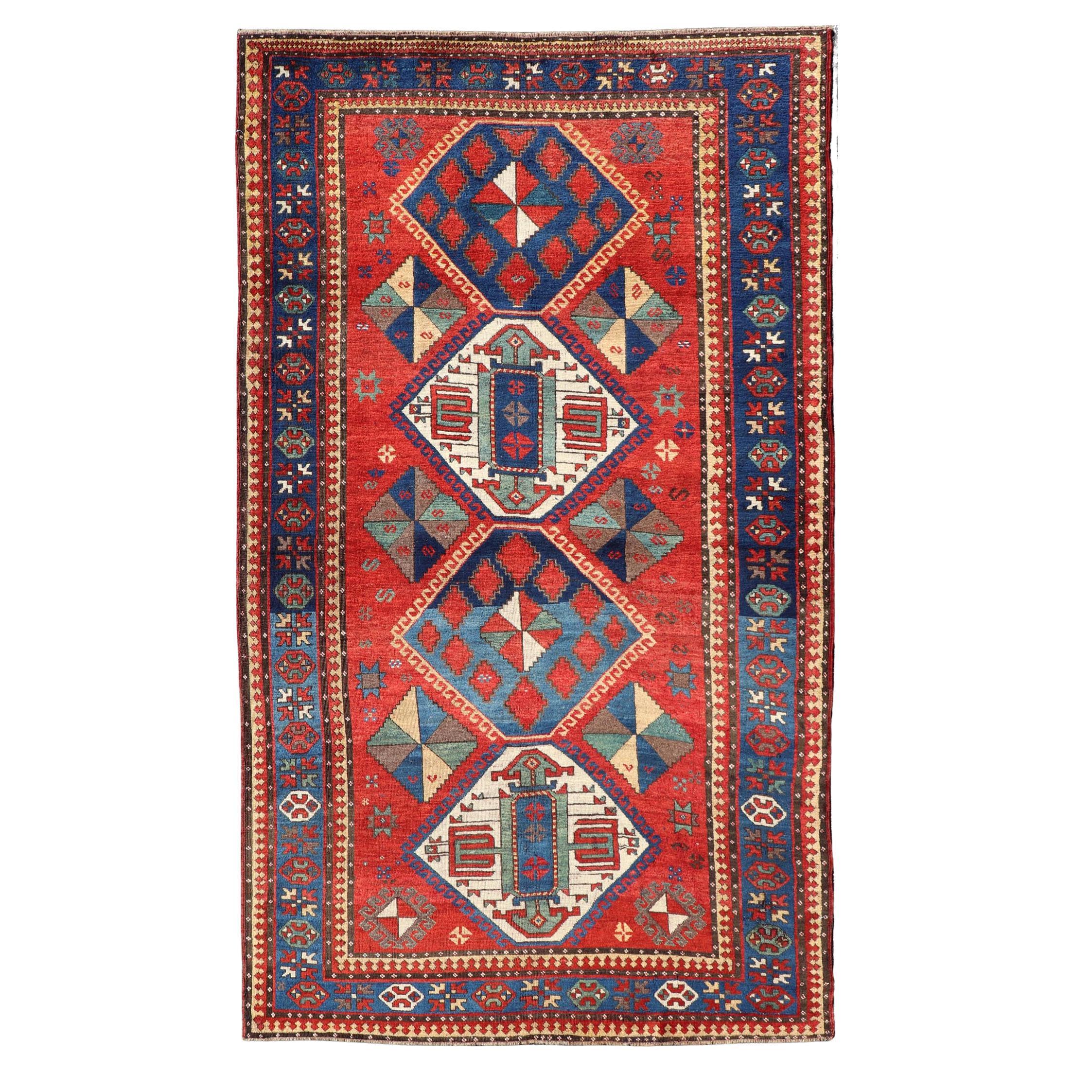 Antique Caucasian Kazak Rug with Four Bold Medallions on Red Field 5'2 x 9'1 For Sale