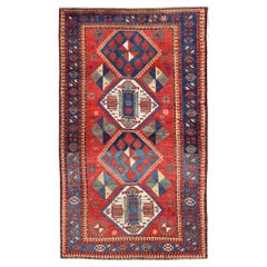 Antique Caucasian Kazak Rug with Four Bold Medallions on Red Field 5'2 x 9'1