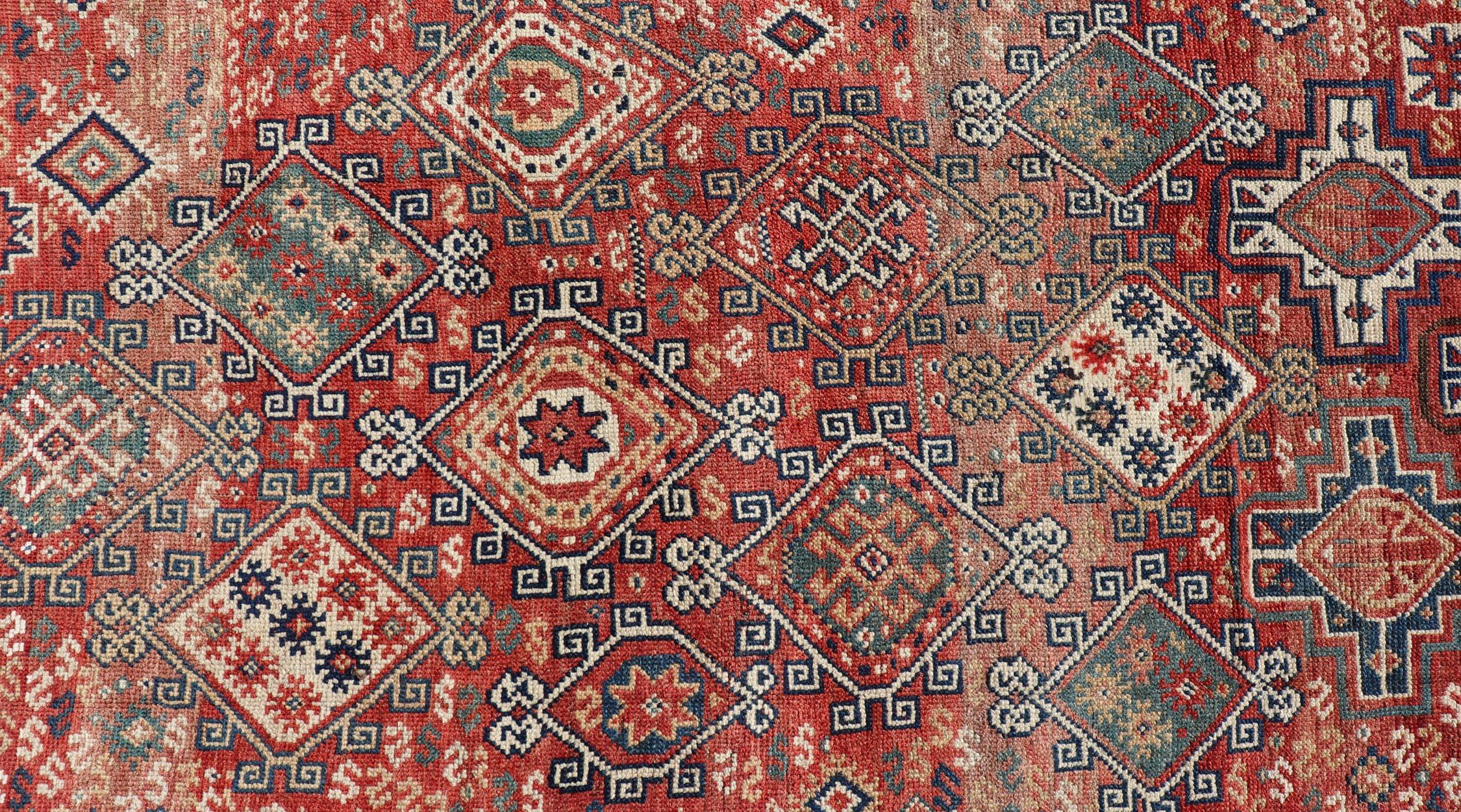 Hand-Knotted Antique Caucasian Kazak Rug with Geometric Design & Tribal Motifs  For Sale