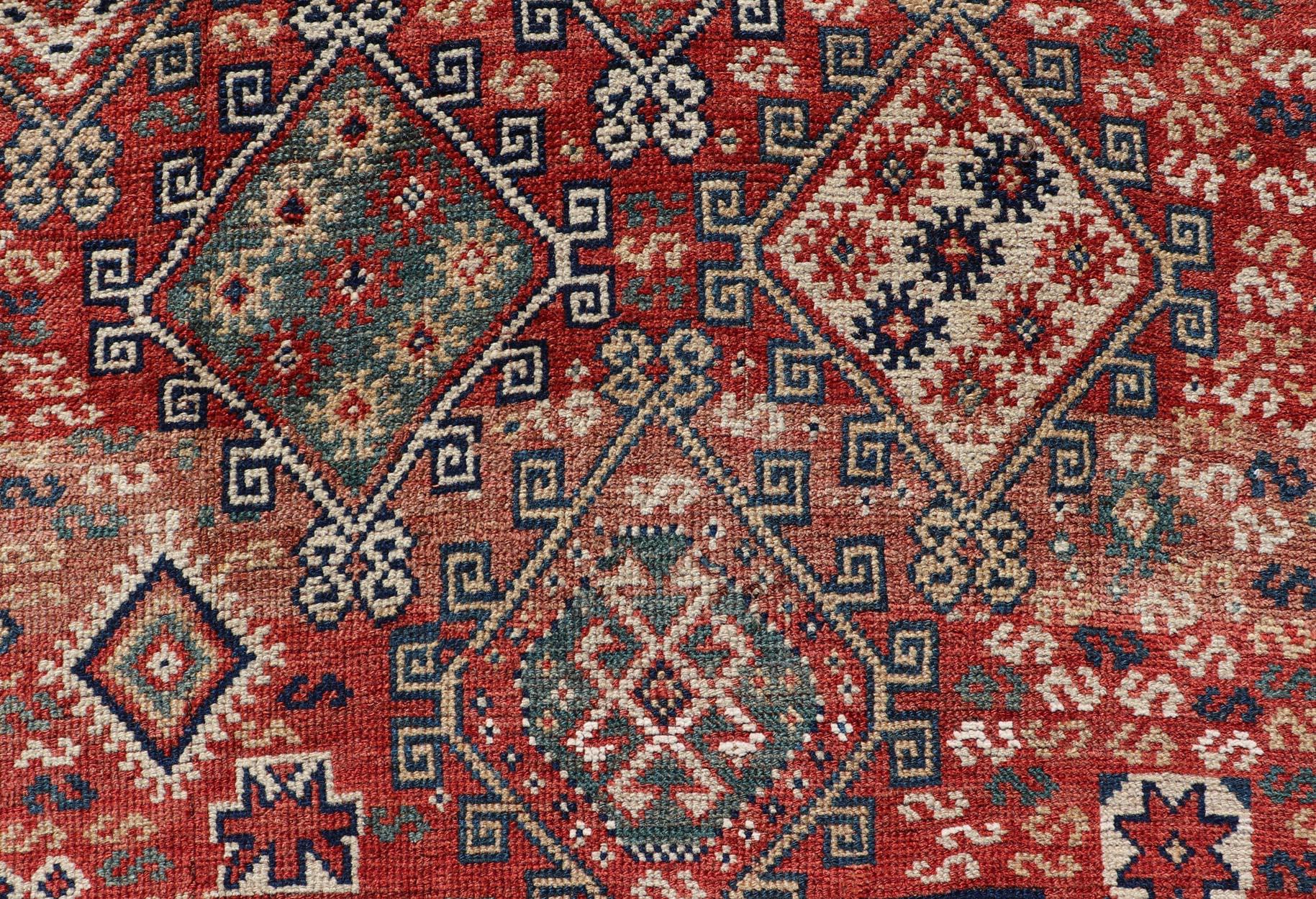 Antique Caucasian Kazak Rug with Geometric Design & Tribal Motifs  In Good Condition For Sale In Atlanta, GA