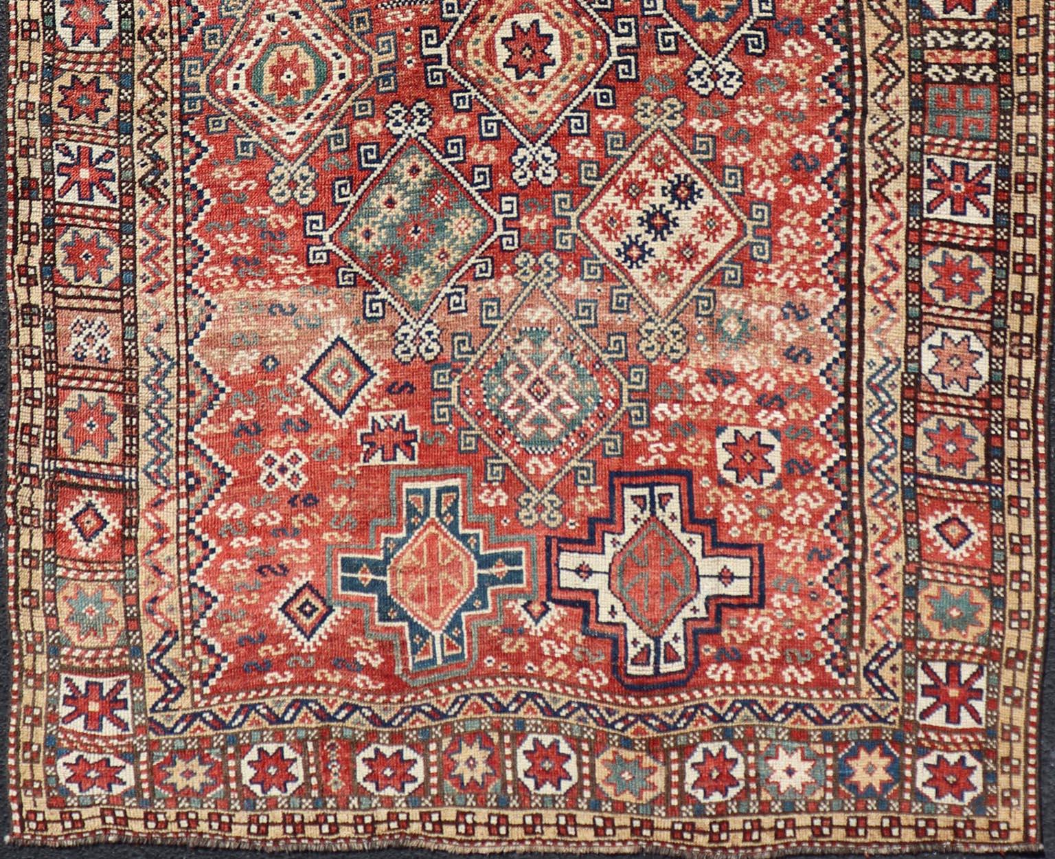 Wool Antique Caucasian Kazak Rug with Geometric Design & Tribal Motifs  For Sale