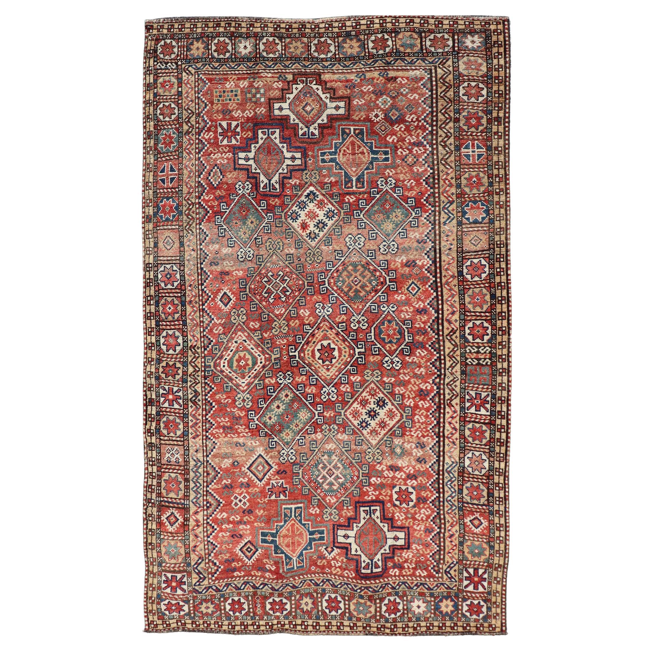 Antique Caucasian Kazak Rug with Geometric Design & Tribal Motifs  For Sale