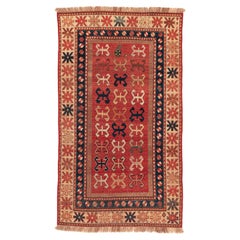 Antique Caucasian Kazak Rug with Repeating Geometric Devices