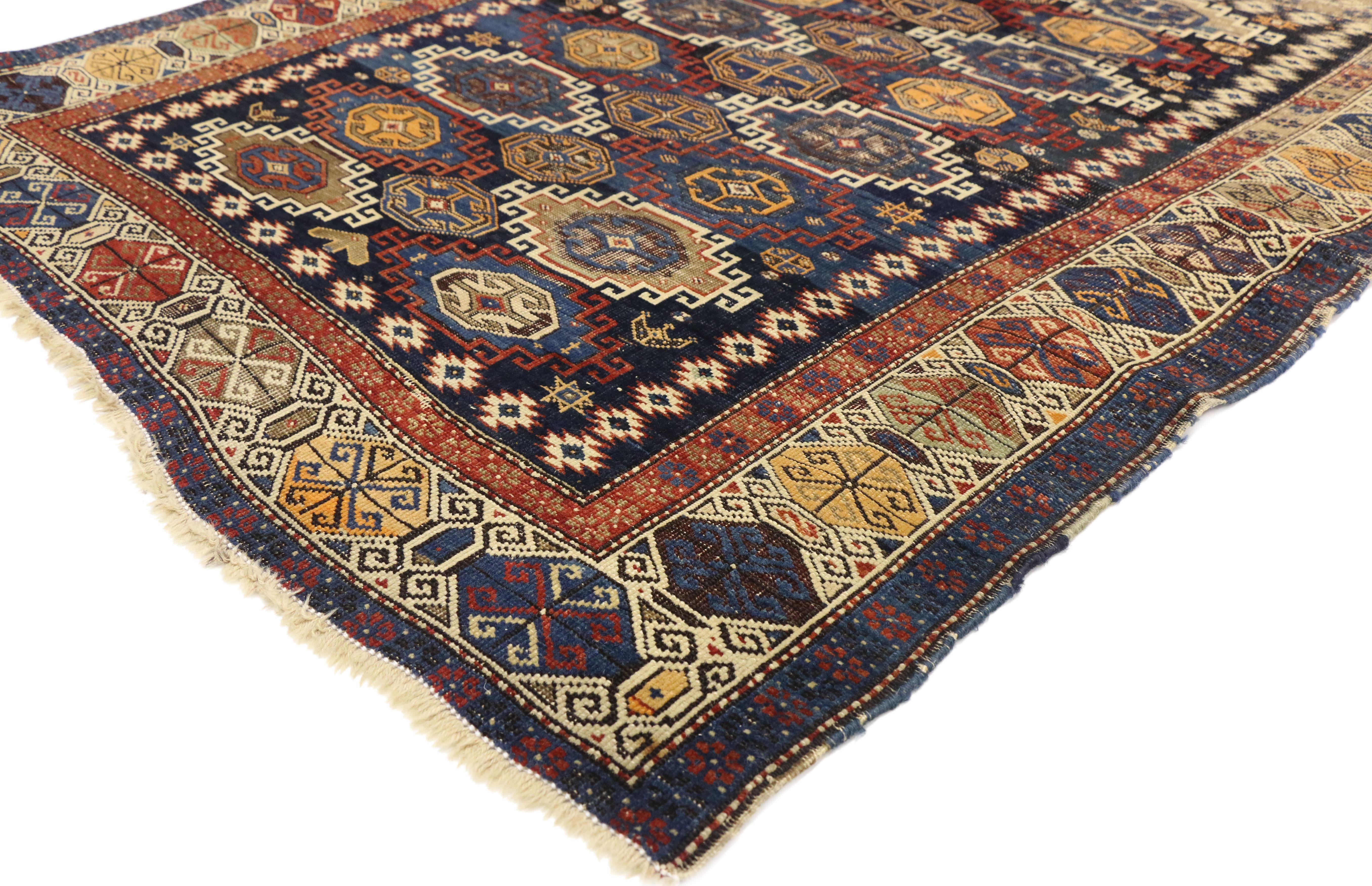 72884, antique Caucasian Kazak rug with rustic tribal style, square rug. This hand knotted wool antique Caucasian Kazak rug with rustic tribal style features multi-color stepped and hooked medallions in an all-over pattern set with octagons and
