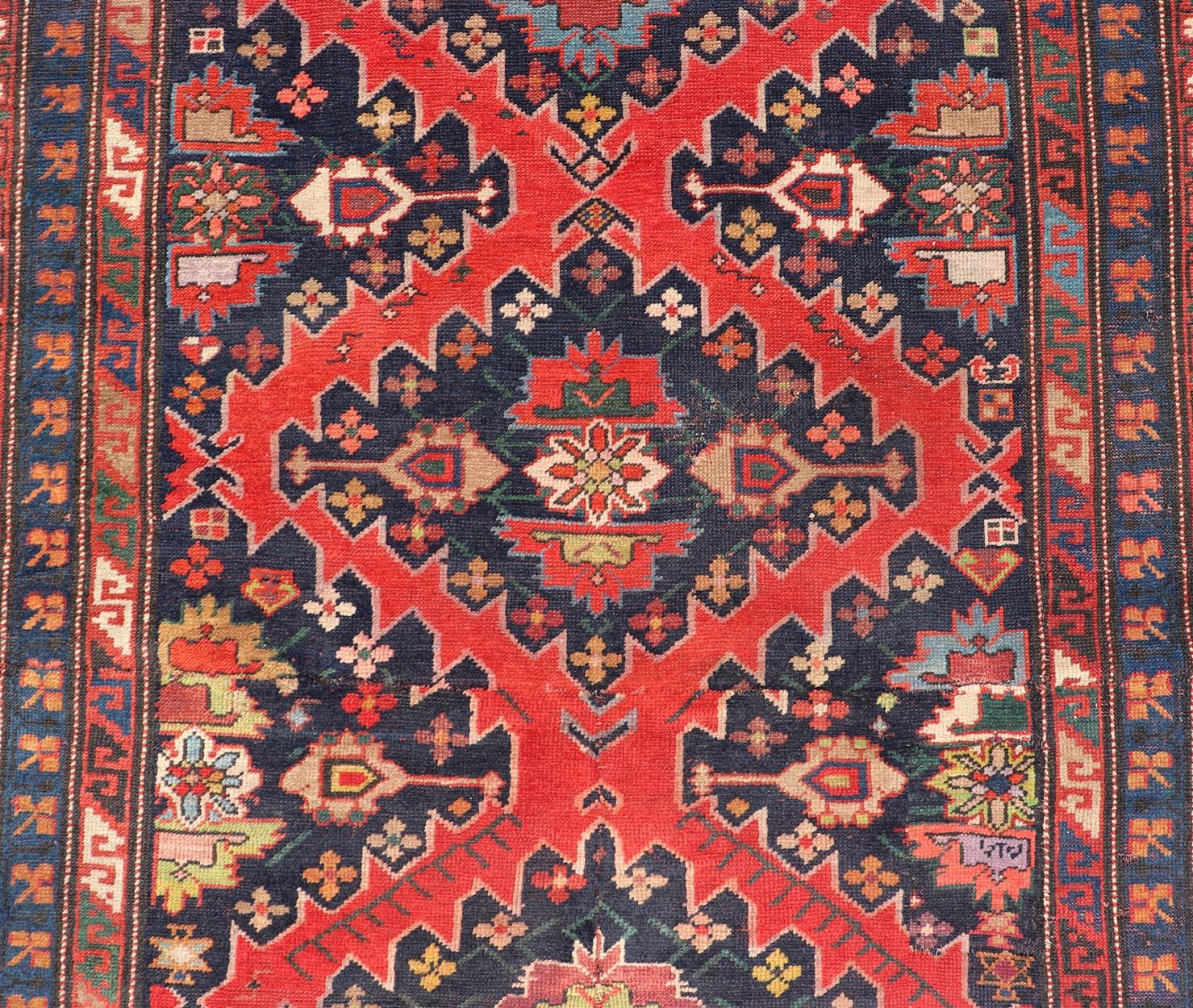 Antique Caucasian Kazak Rug with Sub-Geometric Medallions Design in Red and Blue In Good Condition For Sale In Atlanta, GA