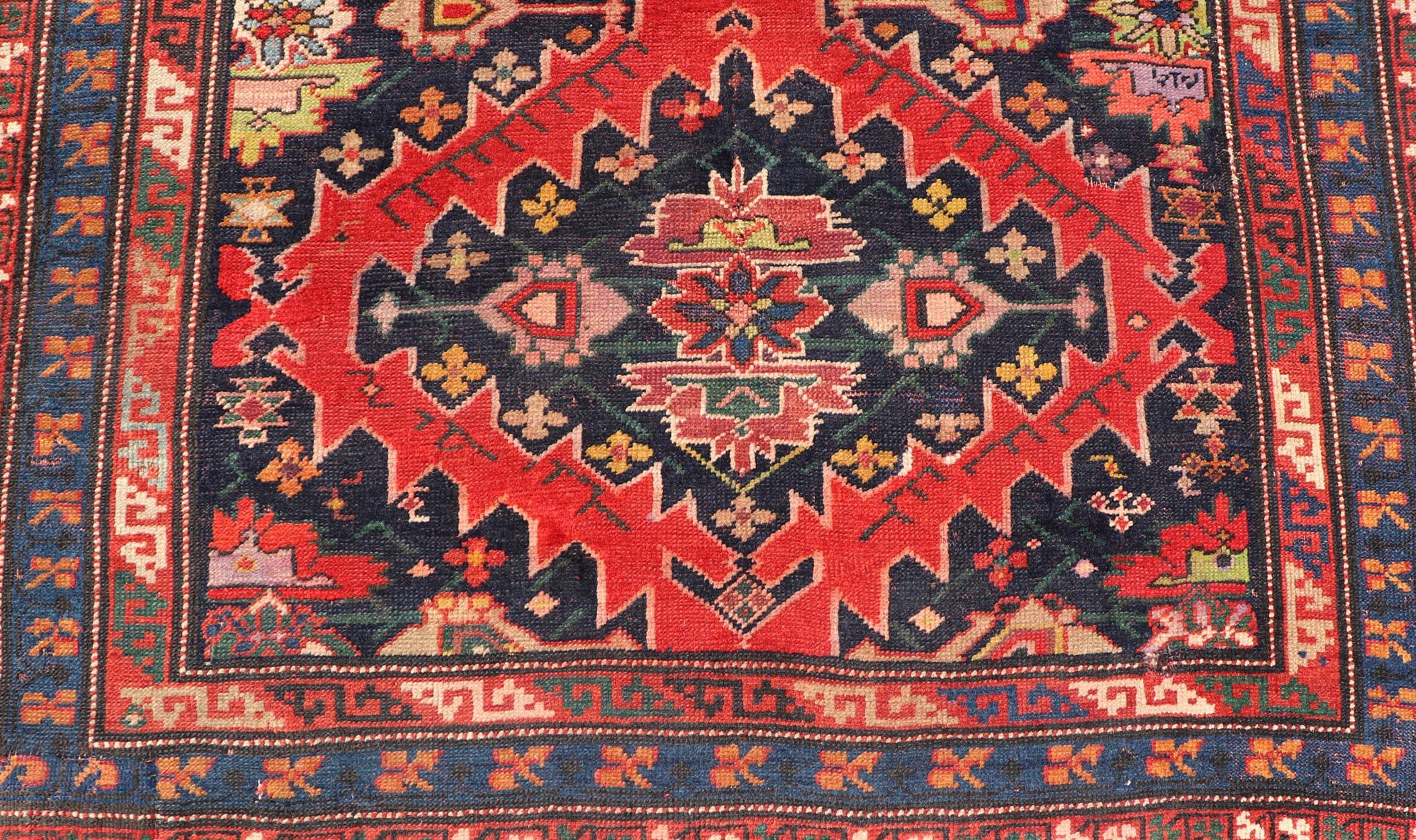 20th Century Antique Caucasian Kazak Rug with Sub-Geometric Medallions Design in Red and Blue For Sale