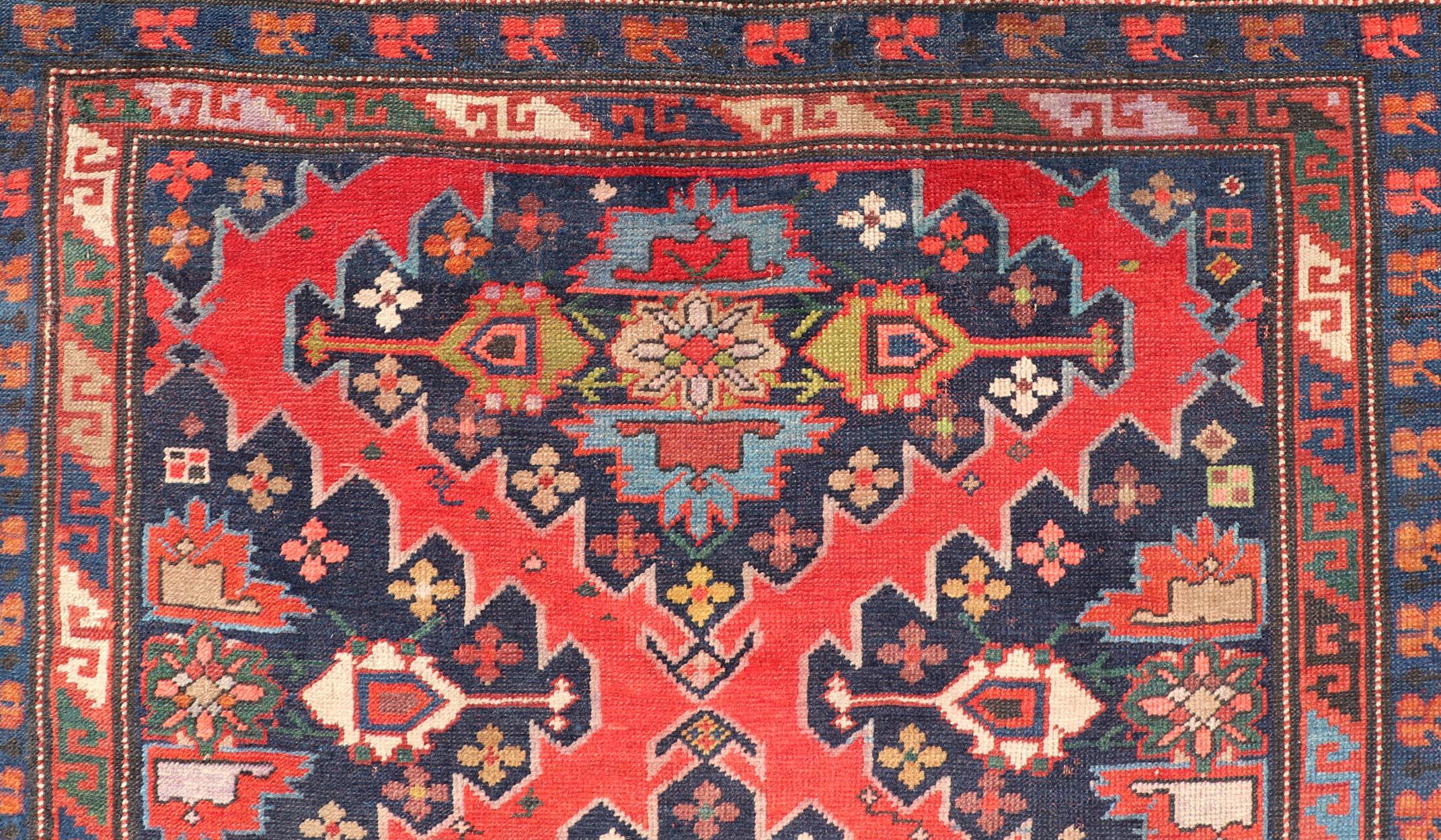 Wool Antique Caucasian Kazak Rug with Sub-Geometric Medallions Design in Red and Blue For Sale