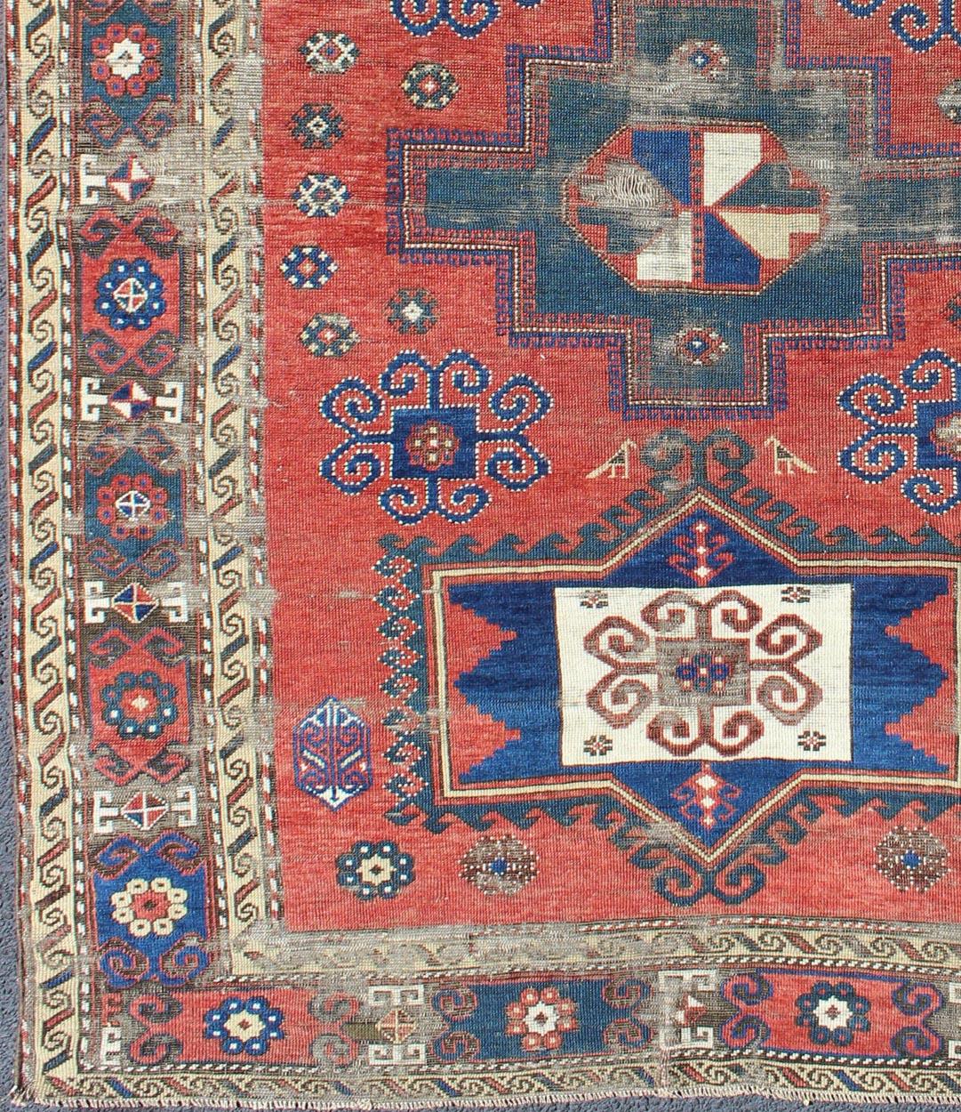 Blue and red Kazak antique rug from Caucasus with Geometric motifs, rug gng-4755, country of origin / type: Iran / Caucasian Kazak, circa 1900.

Kazak rugs are among the most desirable Caucasian rugs. The vibrant reds, blues, and ivories that