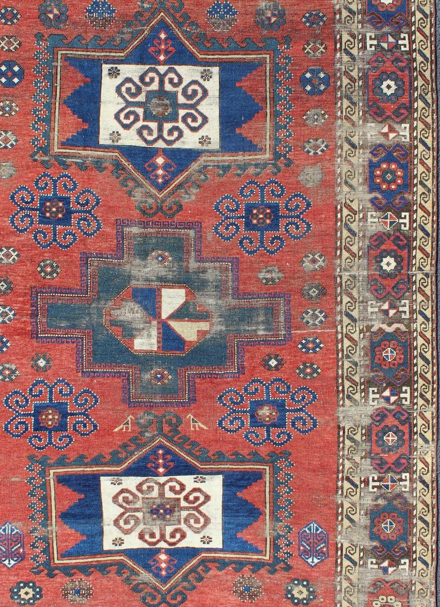 Antique Caucasian Kazak Rug with Tri-Medallion Geometric Design in Red and Blue In Fair Condition In Atlanta, GA