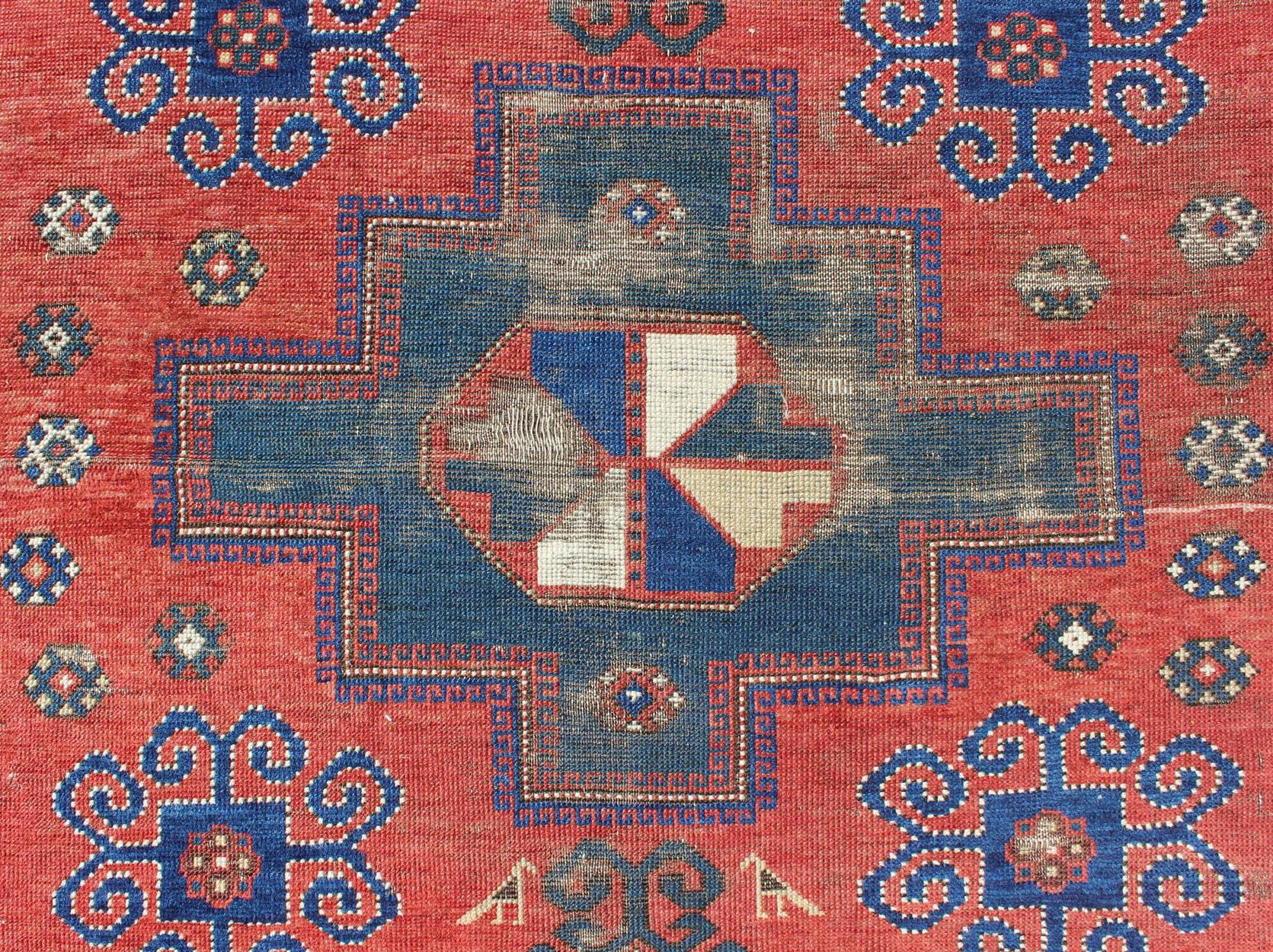 Wool Antique Caucasian Kazak Rug with Tri-Medallion Geometric Design in Red and Blue