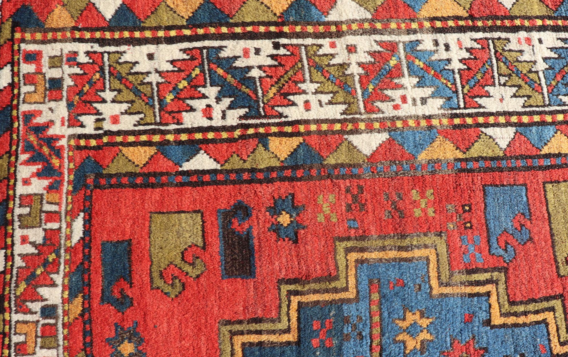 Tribal geometric medallion design Kazak rug antique from Caucasus region in multi-colors. Keivan Woven Arts / rug/EMB-9623-P13571, country of origin / type: Iran / Caucasian Kazak, circa 1900.
Measures: 4'6 x 7.
