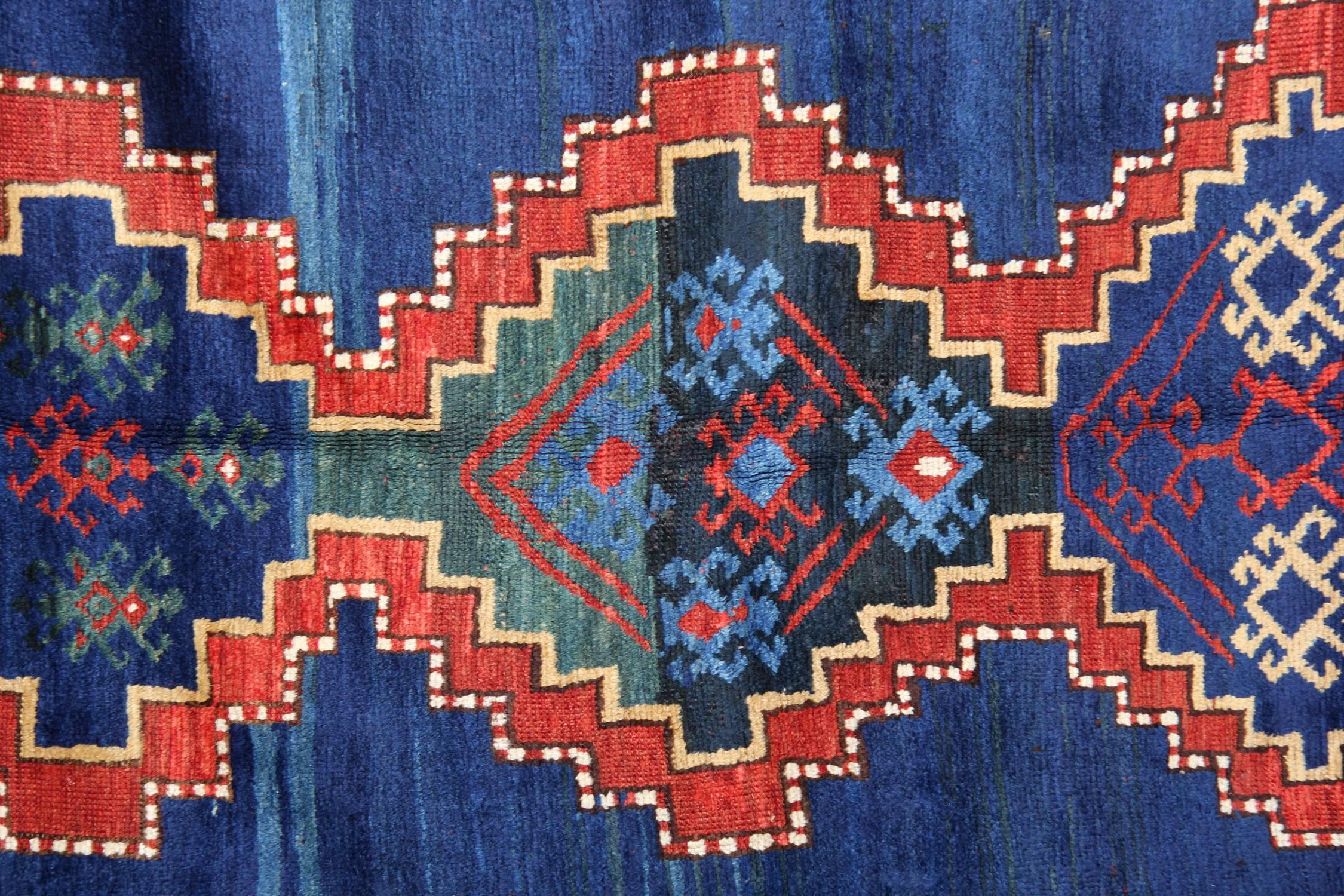 Kazak rugs have primarily been produced as village productions rather than city pieces. Made from materials particular to individual tribal provinces and the rugs of the Caucasus typically display bold geometric designs in primary colours. Kazak