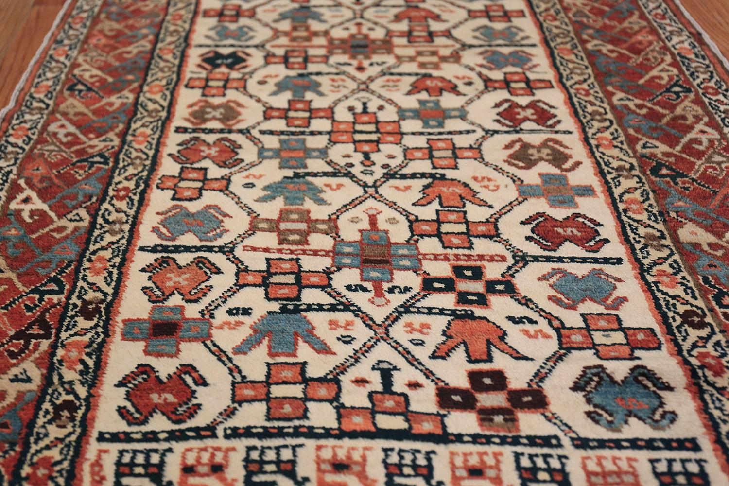 Antique Caucasian Tribal long and narrow Kazak runner, origin: The Caucasus, woven circa 1900. Size: 3 ft 5 in x 12 ft 3 in (1.04 m x 3.73 m).