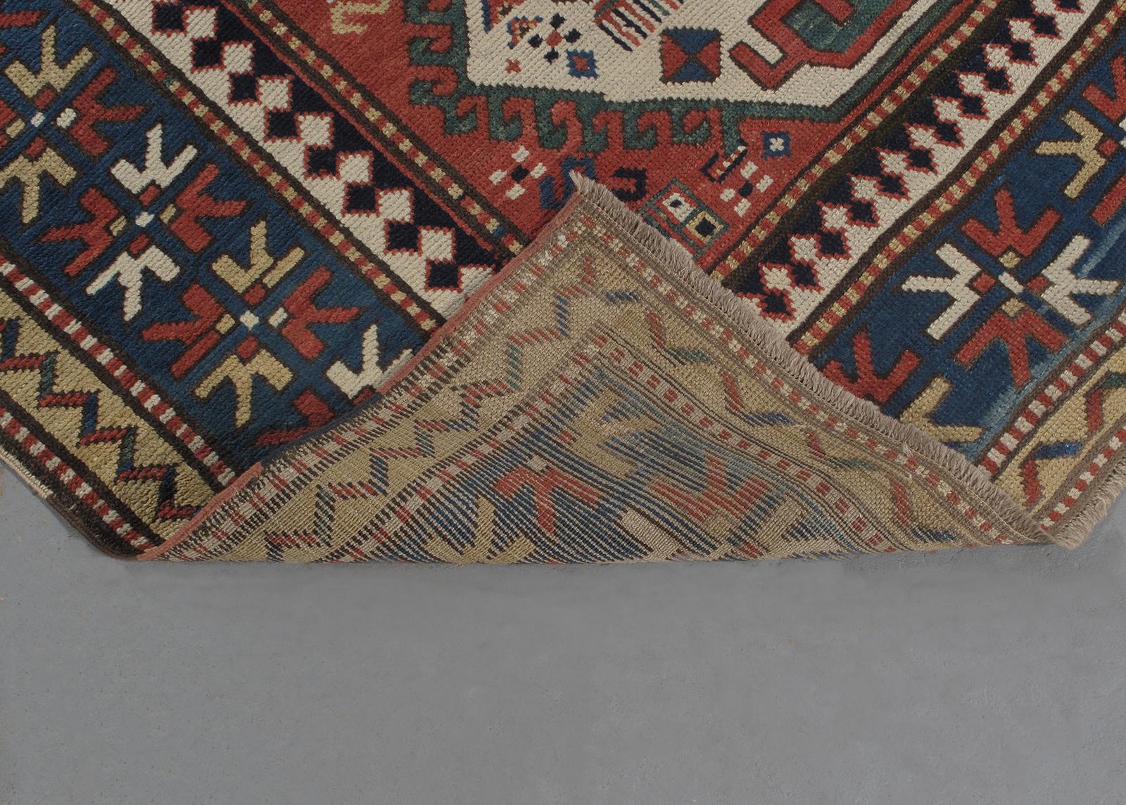 Early 20th Century Antique Caucasian Kazak Tribal Rug For Sale