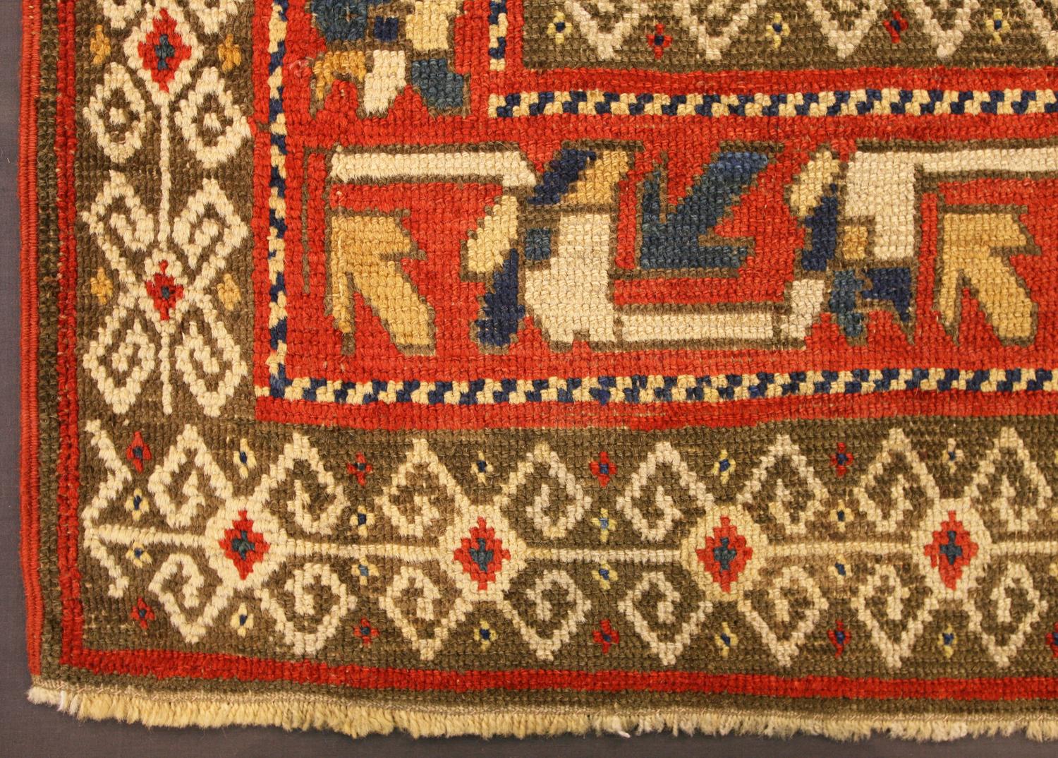 This is an antique Ganja rug woven in the central part of the Caucasus mountains during the end of the 19th century. It has a traditional Ganja design with diagonal strips with repeating hooked boxes within them. The border designs in this rug are