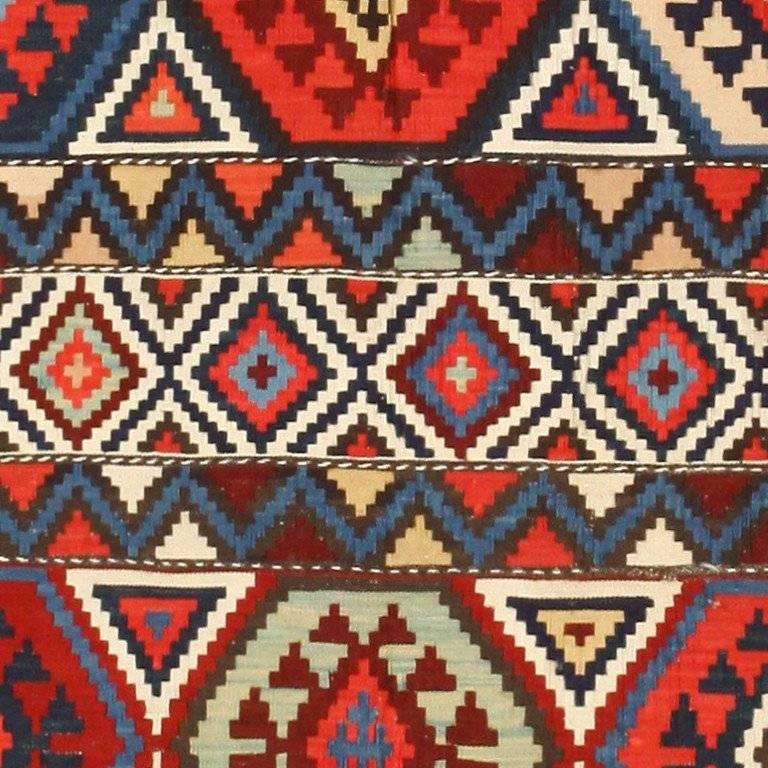 Antique Caucasian Kilim rug, country of origin: Caucasus, Date: circa 1900. Hexagons in vibrant primary colors are the central theme of this antique Caucasian Kilim, circa 1900. Bold shades of color and geometric shapes such as those found in this