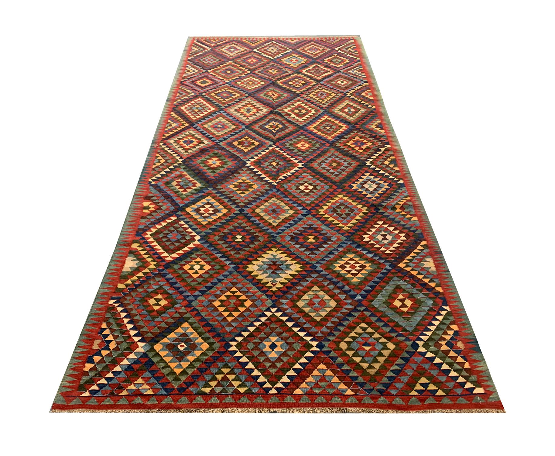 An elegant geometric all-over design decorates this fine antique Caucasian kilim. They were woven in the 1920s. Suitable for use in any room in your home. Style as a bedroom rug, living room rug or entranceway rug. Bold and beautiful this rug will