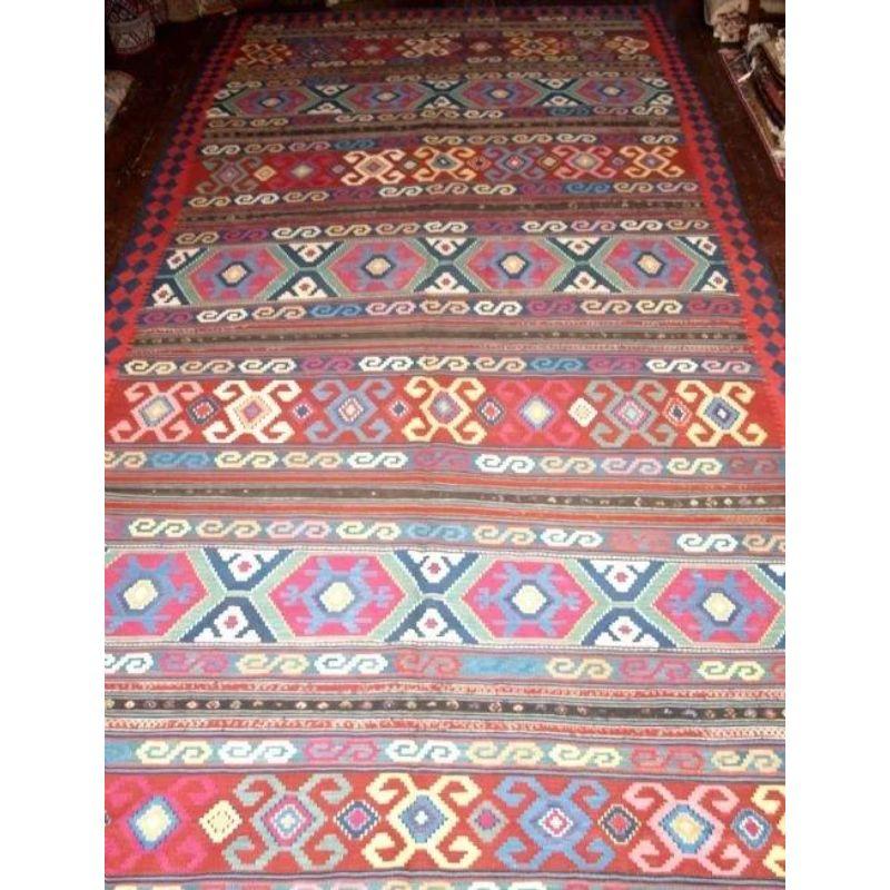 A superb Kilim of classic Kuba region design. The kilim has bands of embroidered work running across it. Very well drawn with excellent colour.

Excellent condition with slight even wear. A kilim of large size suitable for floor use. Hand washed