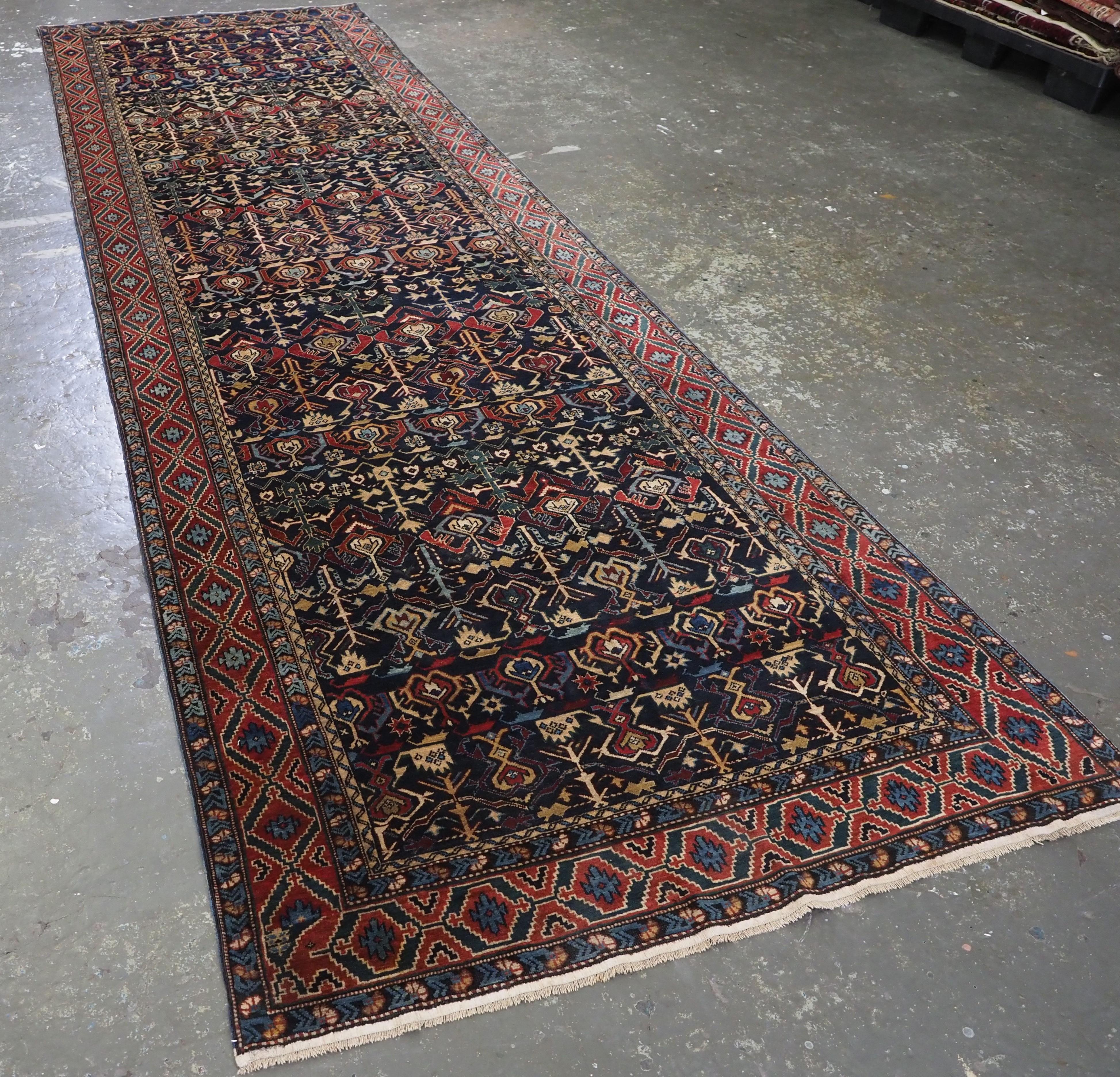 Size: 14ft 2in x 4ft 3in (433 x 129cm).

Antique Caucasian Kuba region 'Konagkend' runner, with all over repeat design.

Circa 1900.

The dark indigo field is filled with finely drawn repeat design, typical of those found in the Kuba region