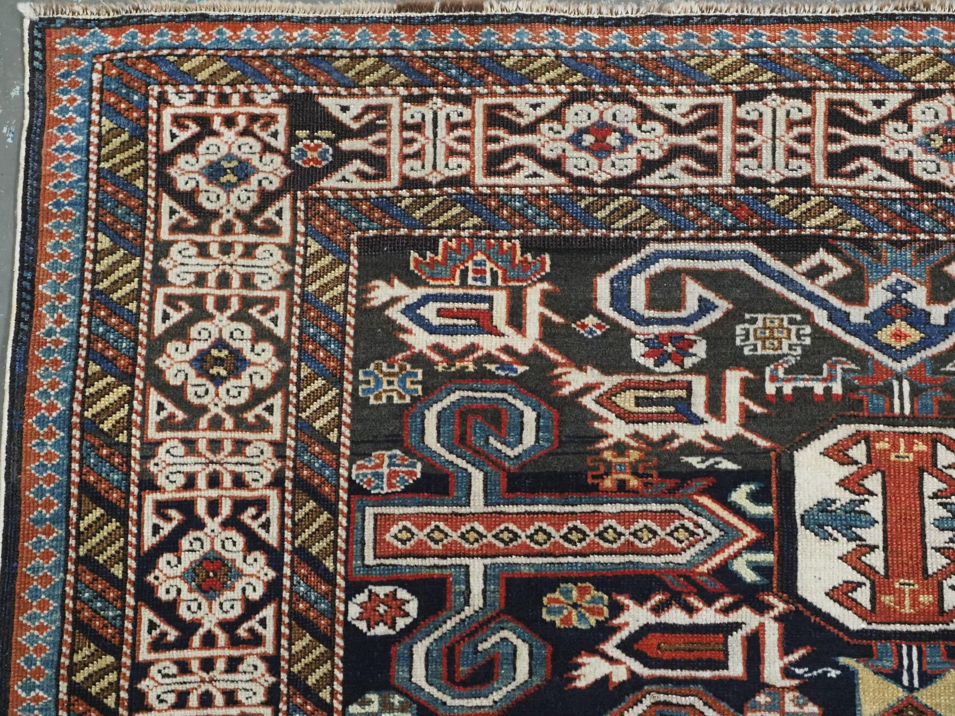Antique Caucasian Kuba region Perepedil rug with an indigo blue ground. For Sale 1