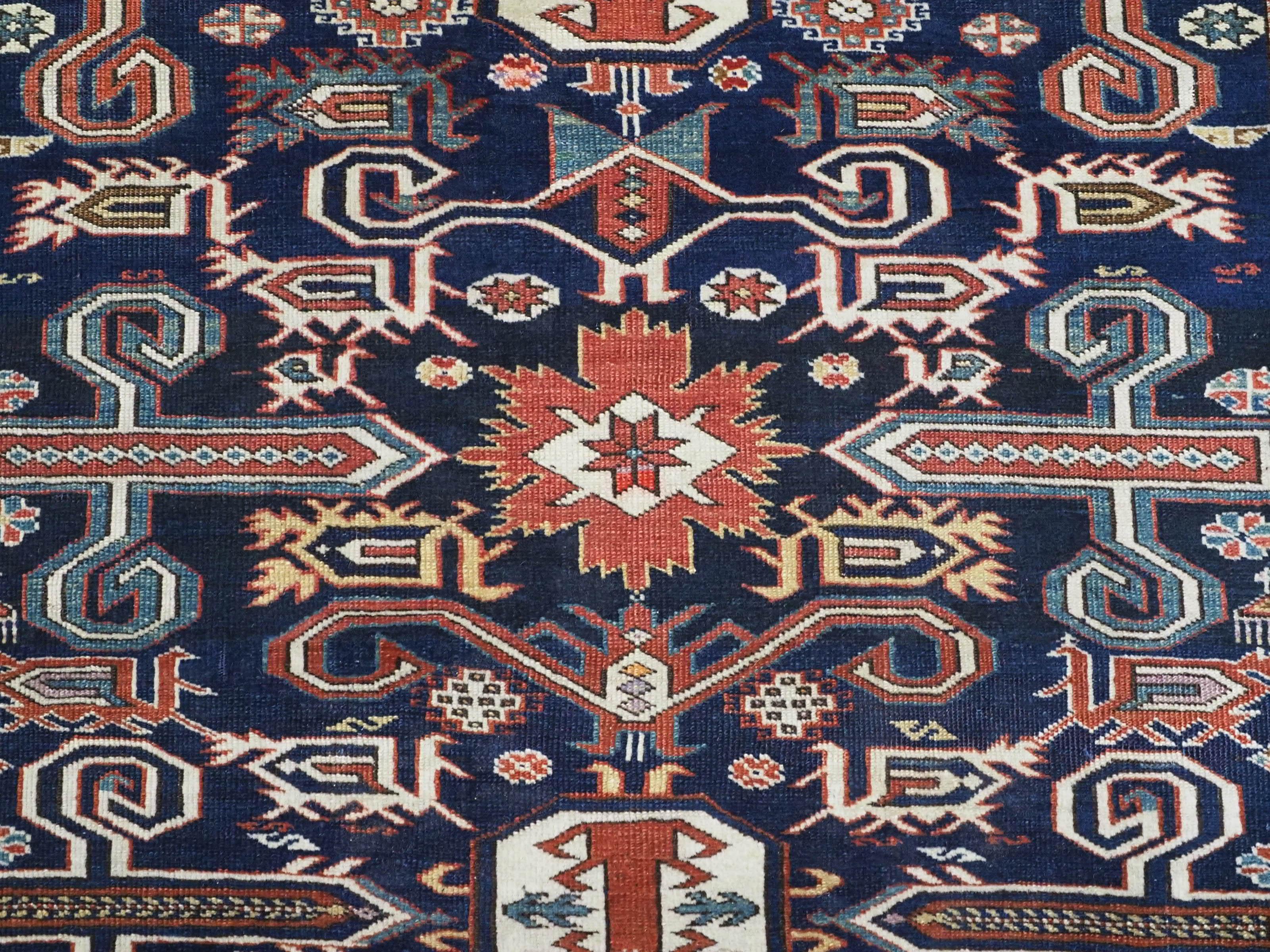 Antique Caucasian Kuba region Perepedil rug with an indigo blue ground. For Sale 4