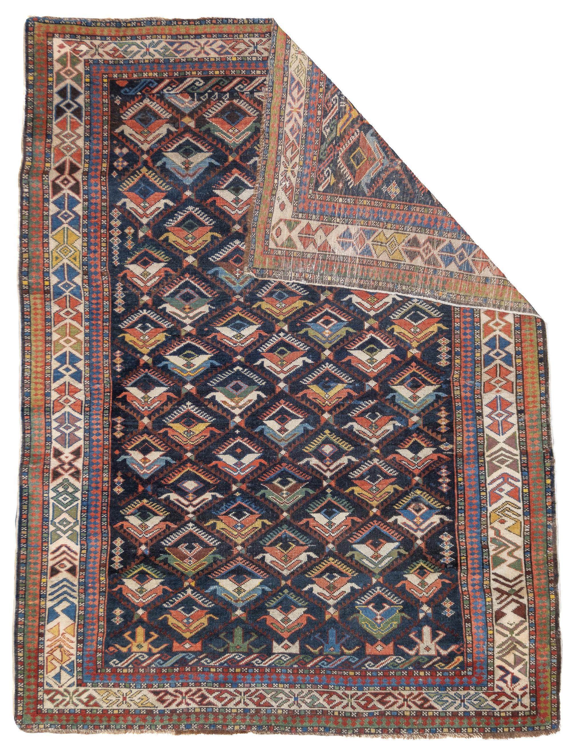 Antique Caucasian Kuba Rug 3'10'' x 5'1''.  Azeri Turks inhabit the Kuba area of the central west Caspian Caucasus and weave a wide variety of geometric scatters, runners, long rugs and niche (prayer) pieces, in geometric allover and medallion