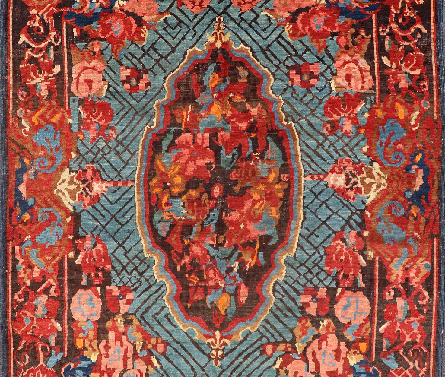 Antique Caucasian Kuba Rug with a Central Floral Medallion In Excellent Condition For Sale In Atlanta, GA