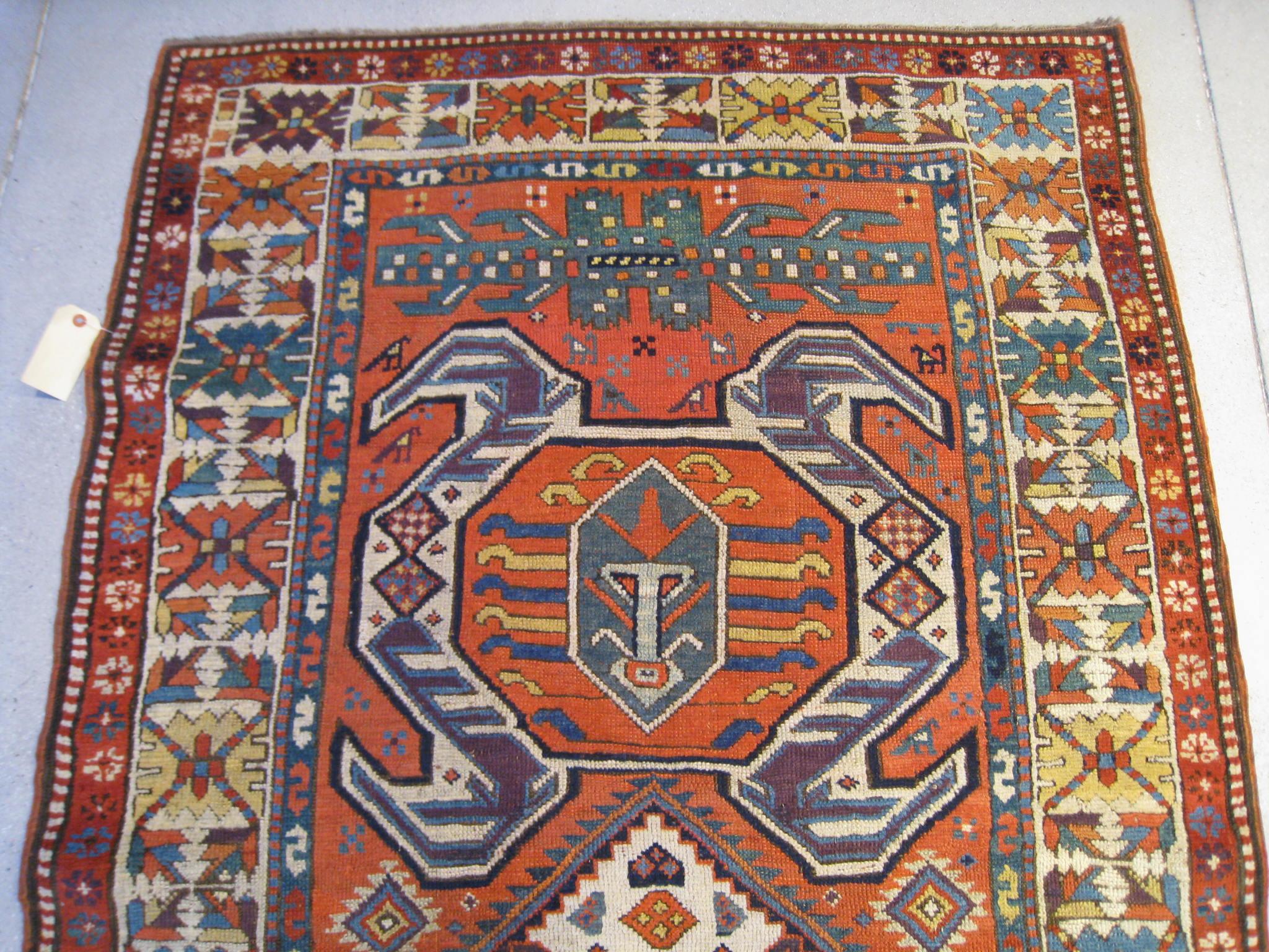 A bold and graphic Lenkoran runner from the Southeast Caucasus featuring a traditional pattern of water bug medallions on an amber field. This runner would work well in both a traditional or contemporary interior. 11' 7