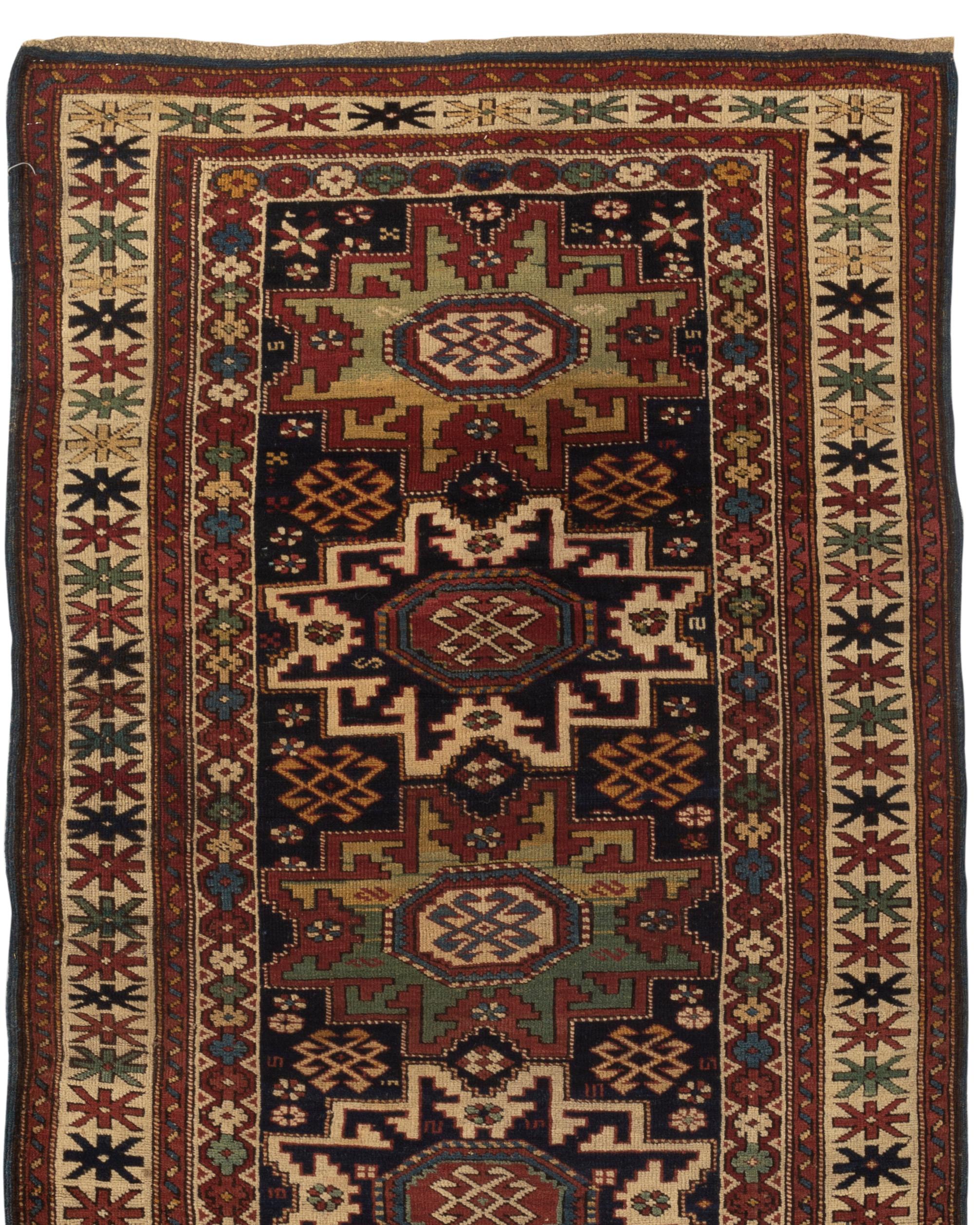 Antique Caucasian Lesghi Star rug, circa 1880, the central field with the four Lesghi star motifs two in navy and ivory and the others in shades of greens enclosed by multiple borders that set the frame for the central design in a very picturesque