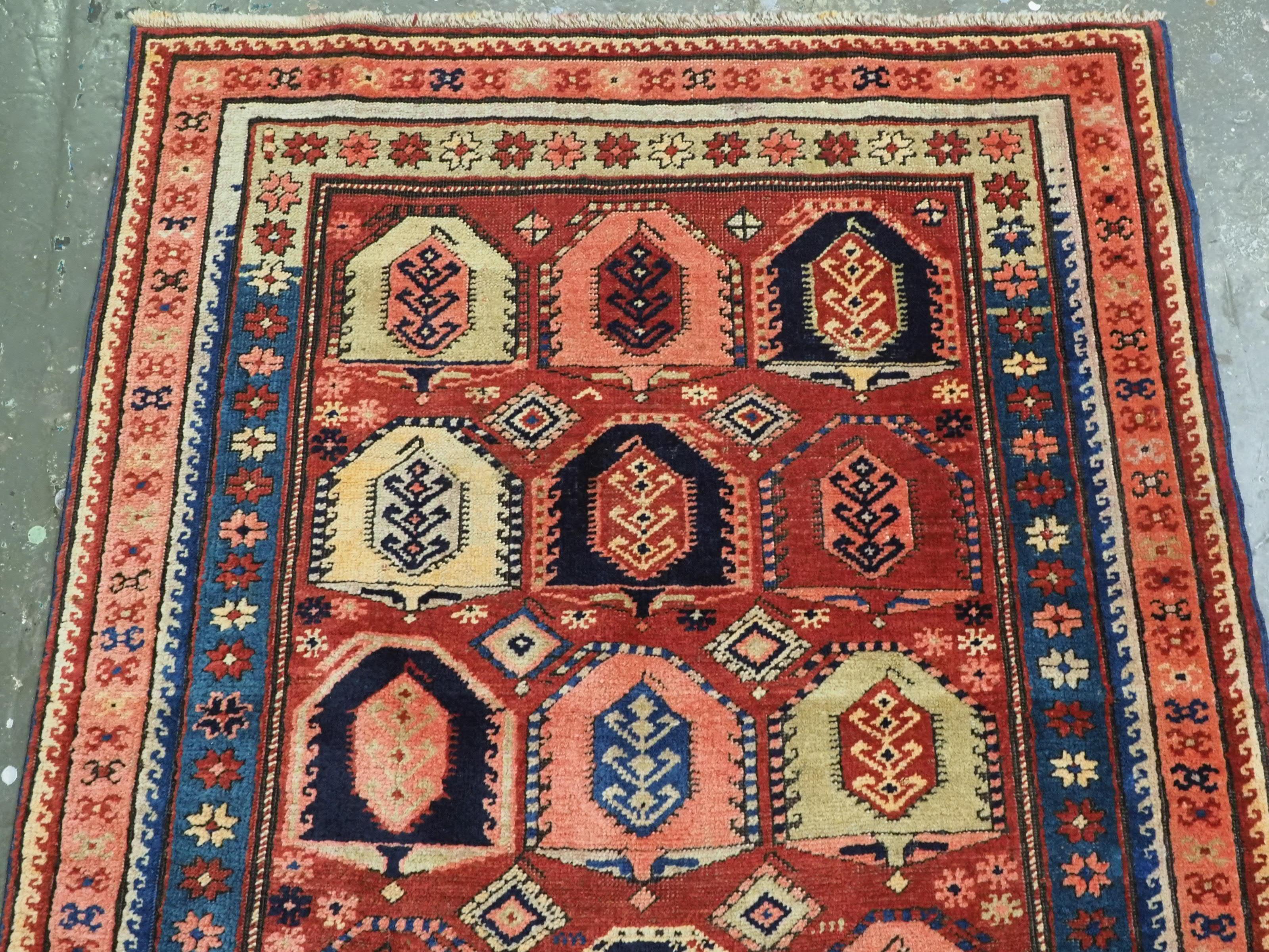 Antique Caucasian long rug with all over boteh design.  Circa 1900. In Good Condition For Sale In Moreton-In-Marsh, GB