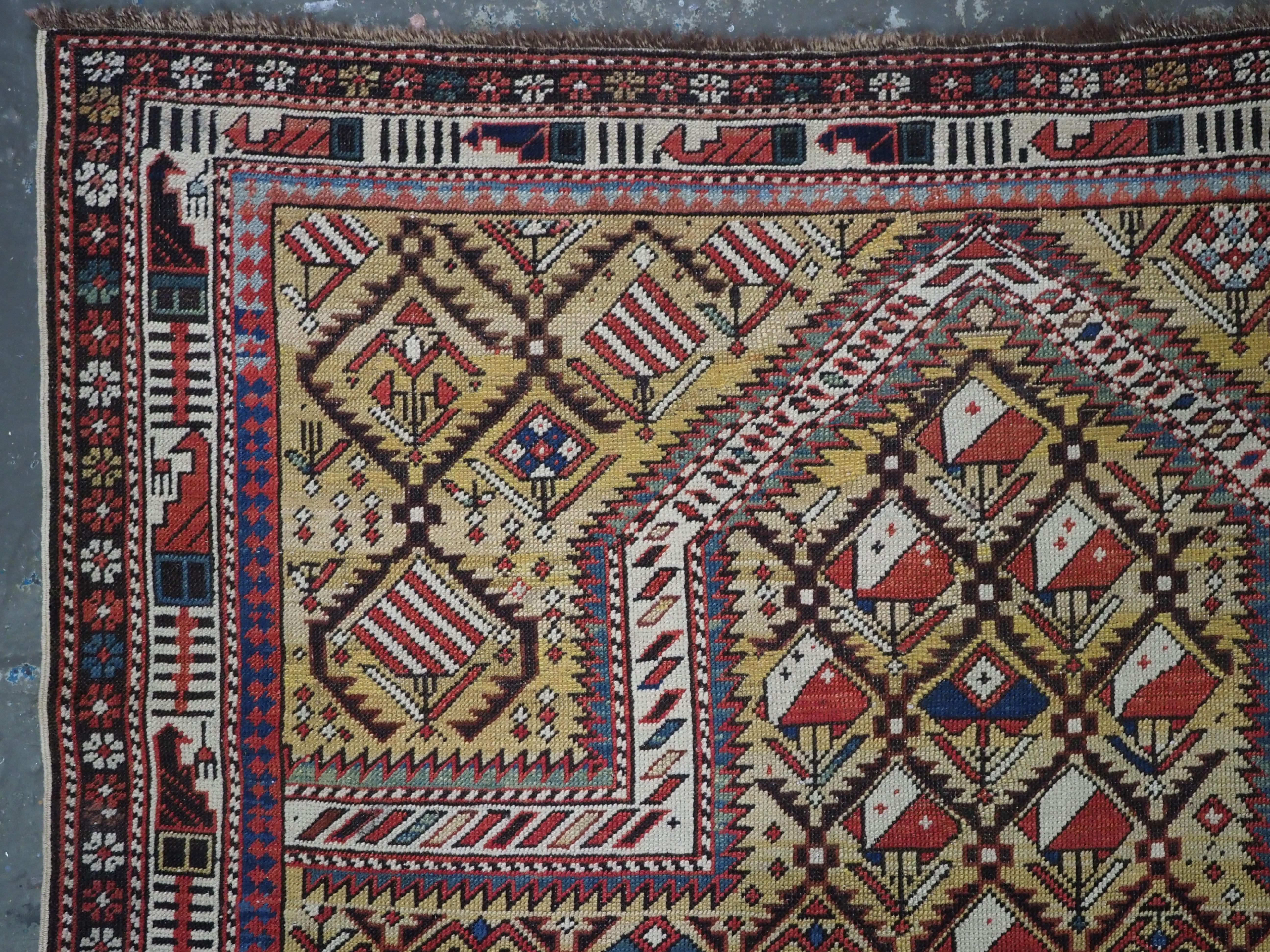 Size: 4ft 6in x 4ft 0in. (137 x 121cm).

Antique Caucasian Marasali prayer rug of the scarce 'yellow' ground colour.

Circa 1850 or earlier.

This outstanding rug belongs to a scarce group of yellow ground prayer rugs with a diamond lattice. Each