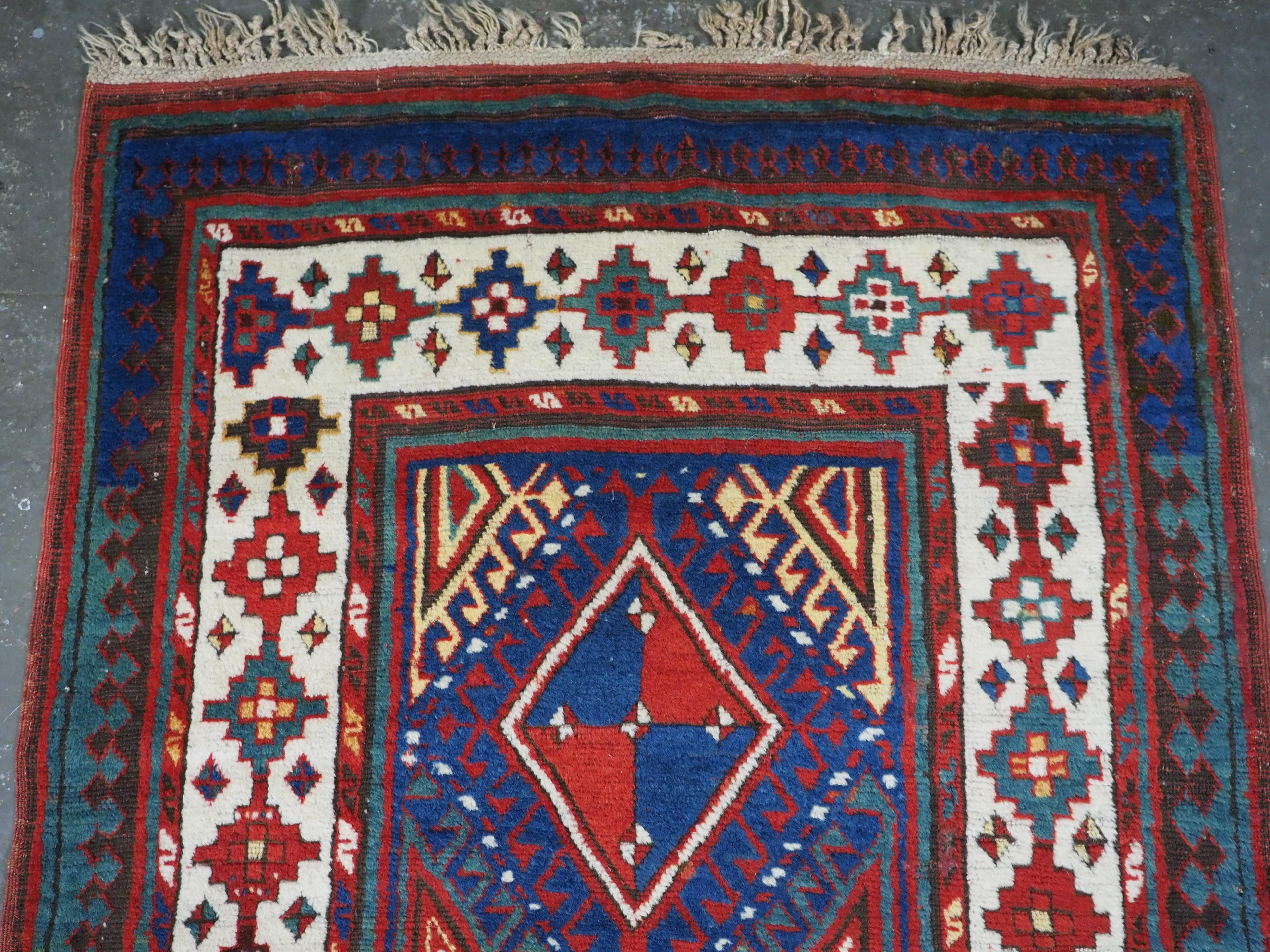 
Size: 10ft 8in x 3ft 7in (326 x 110cm).

Antique Caucasian Moghan Kazak long rug / runner with a vertical row of 6 hooked medallions.

Circa 1880.

Moghan is a mountainous region to the west of Talish in the southern Caucasus, this rug is typical