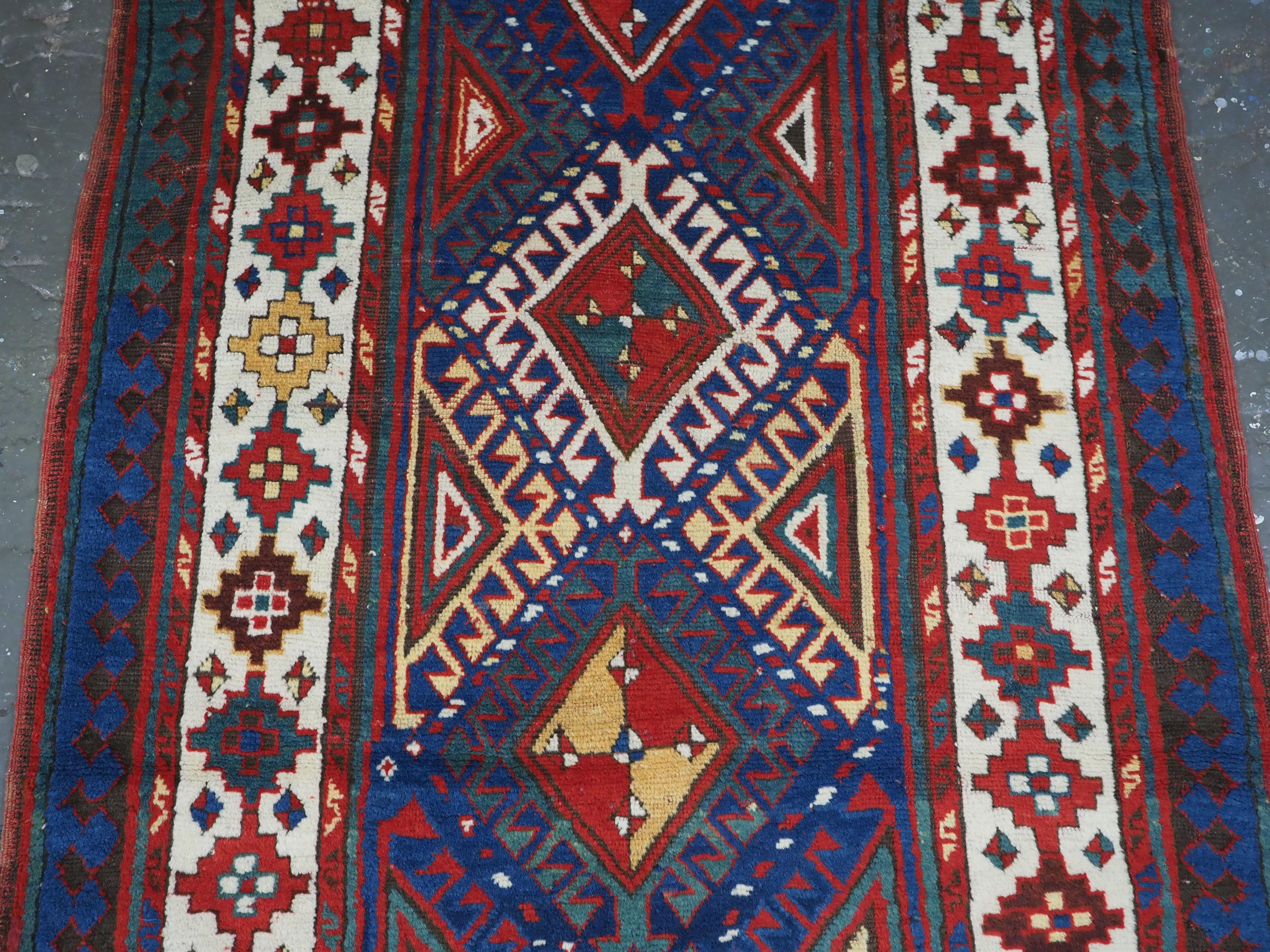 Asian Antique Caucasian Moghan Kazak long rug / runner, circa 1880. For Sale