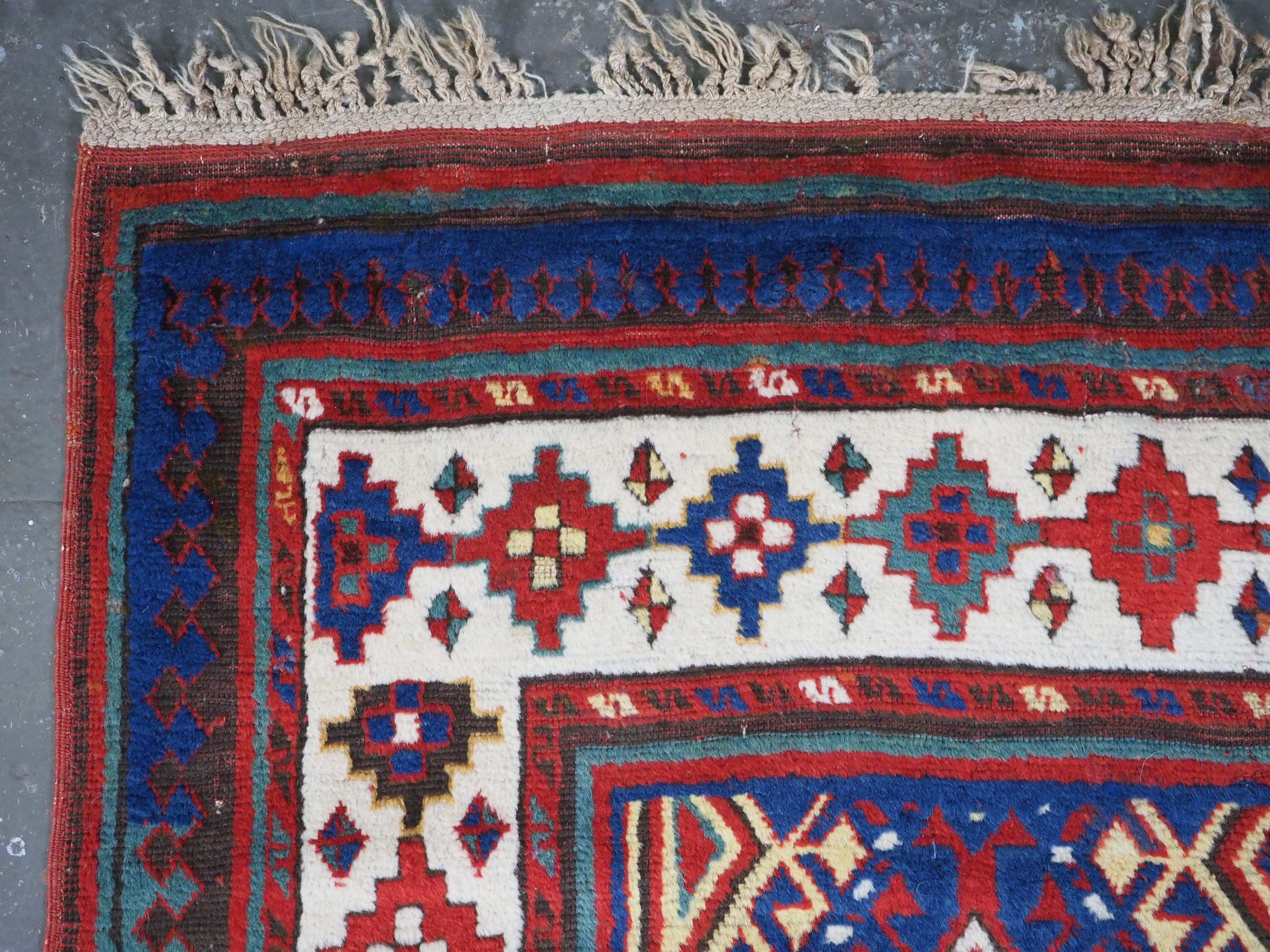 Wool Antique Caucasian Moghan Kazak long rug / runner, circa 1880. For Sale