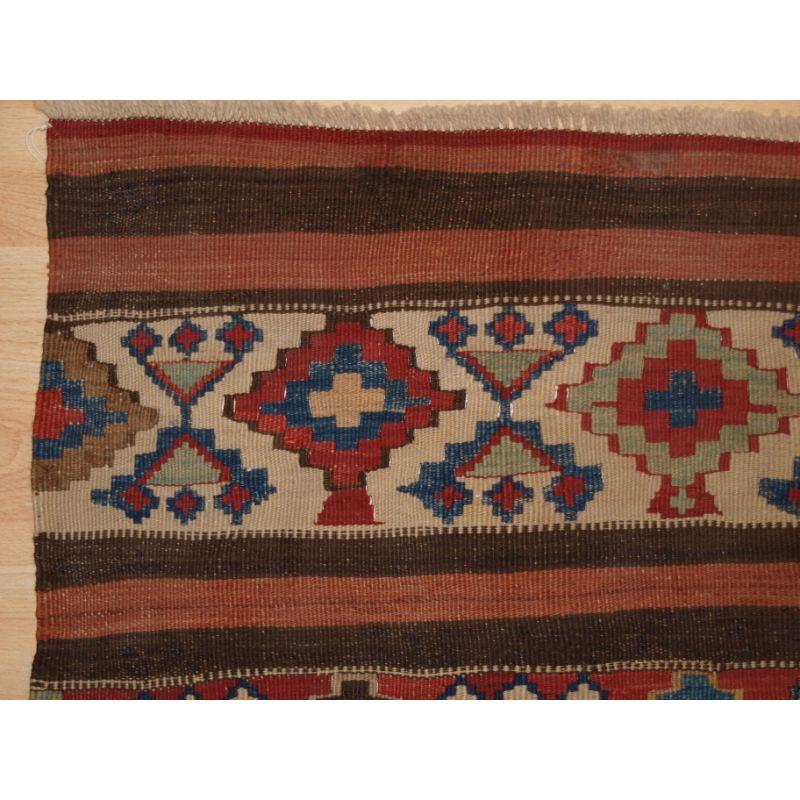 Antique South East Caucasian or Shahsavan Kilim panel.

Plain weave Kilim with banded design. This small Kilim would make an excellent table top decoration or even a wall hanging.

Hand washed and ready for display.

Additional information:
Origin: