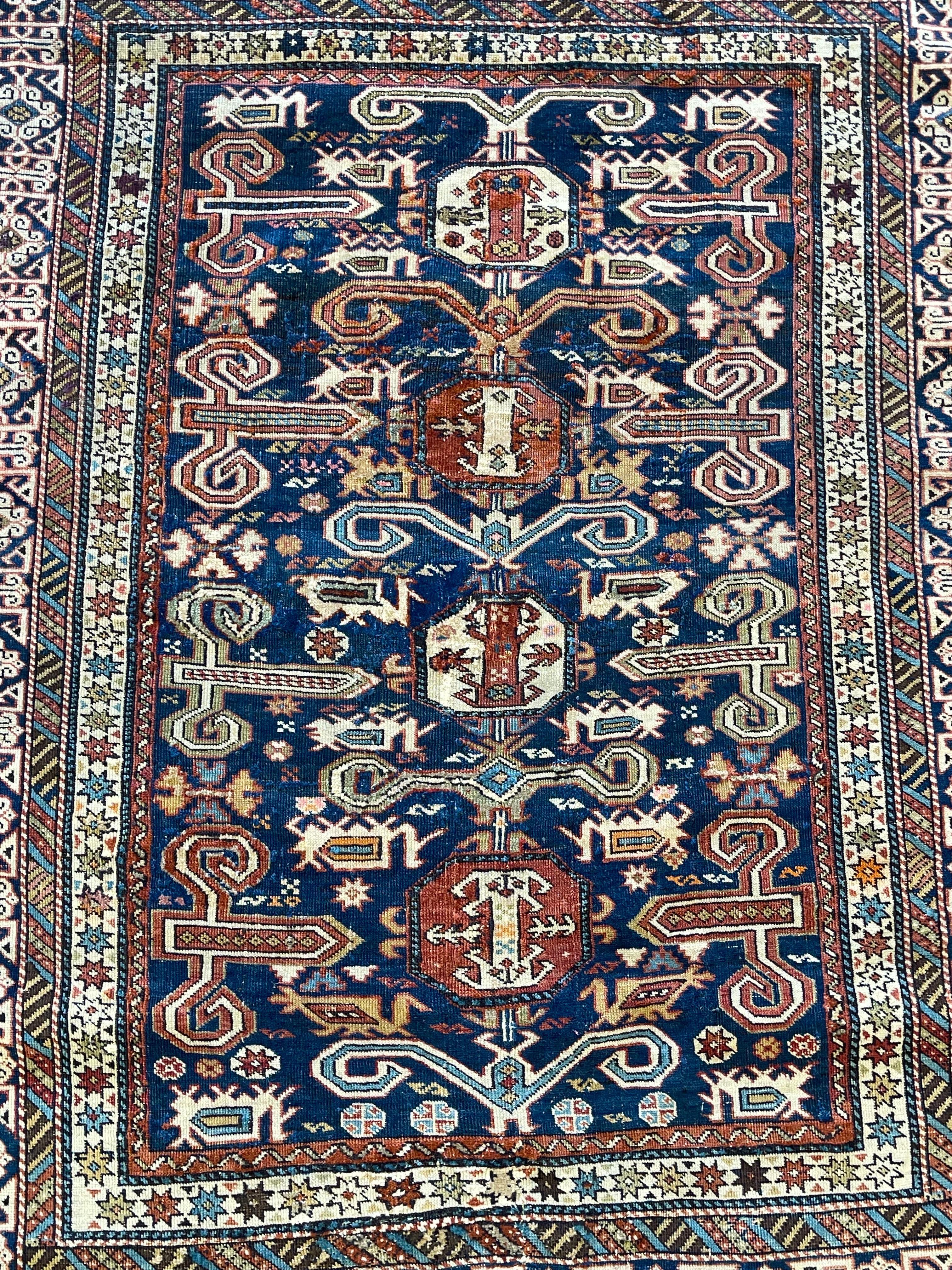 One of the most distinctive groups of Caucasian rugs,Perpedil is named after a town in caucasus. This rug has a handsome appearance and particularly pleasing palette. As for most antique classic Perpedil the ground is surrounded by a Kufic border.
