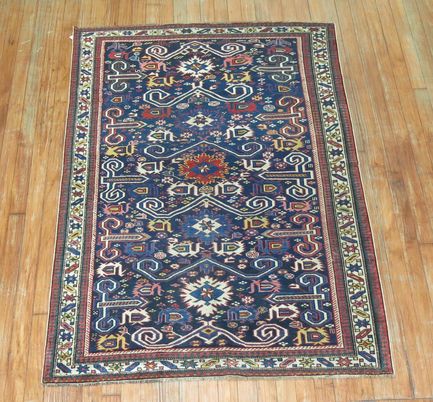 An authentic navy blue antique Caucasian perdedil rug.