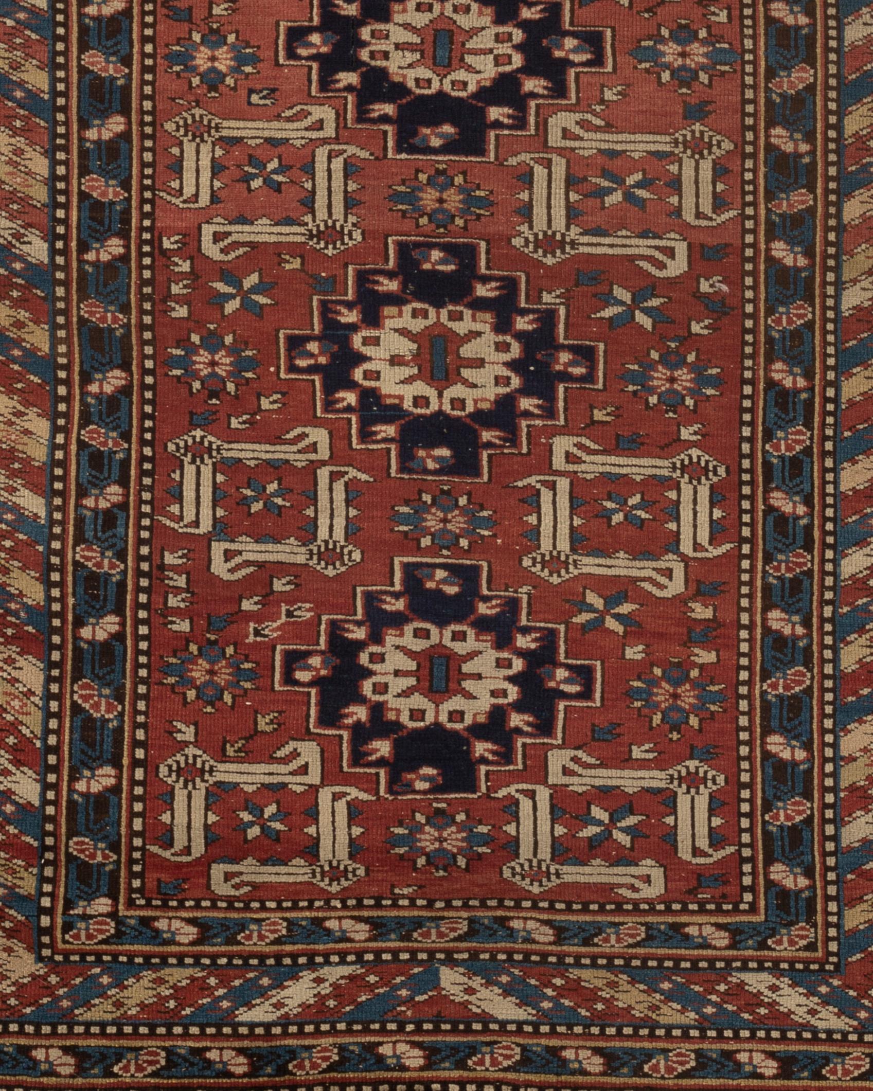 Antique Caucasian Perpedil Shirvan rug circa 1880 from the town of the same name situated to the southeast of Kuba in the Caucasian region of Daghestan. Featuring the distinctive ram's Horn design associated with rugs from this area on a rust ground