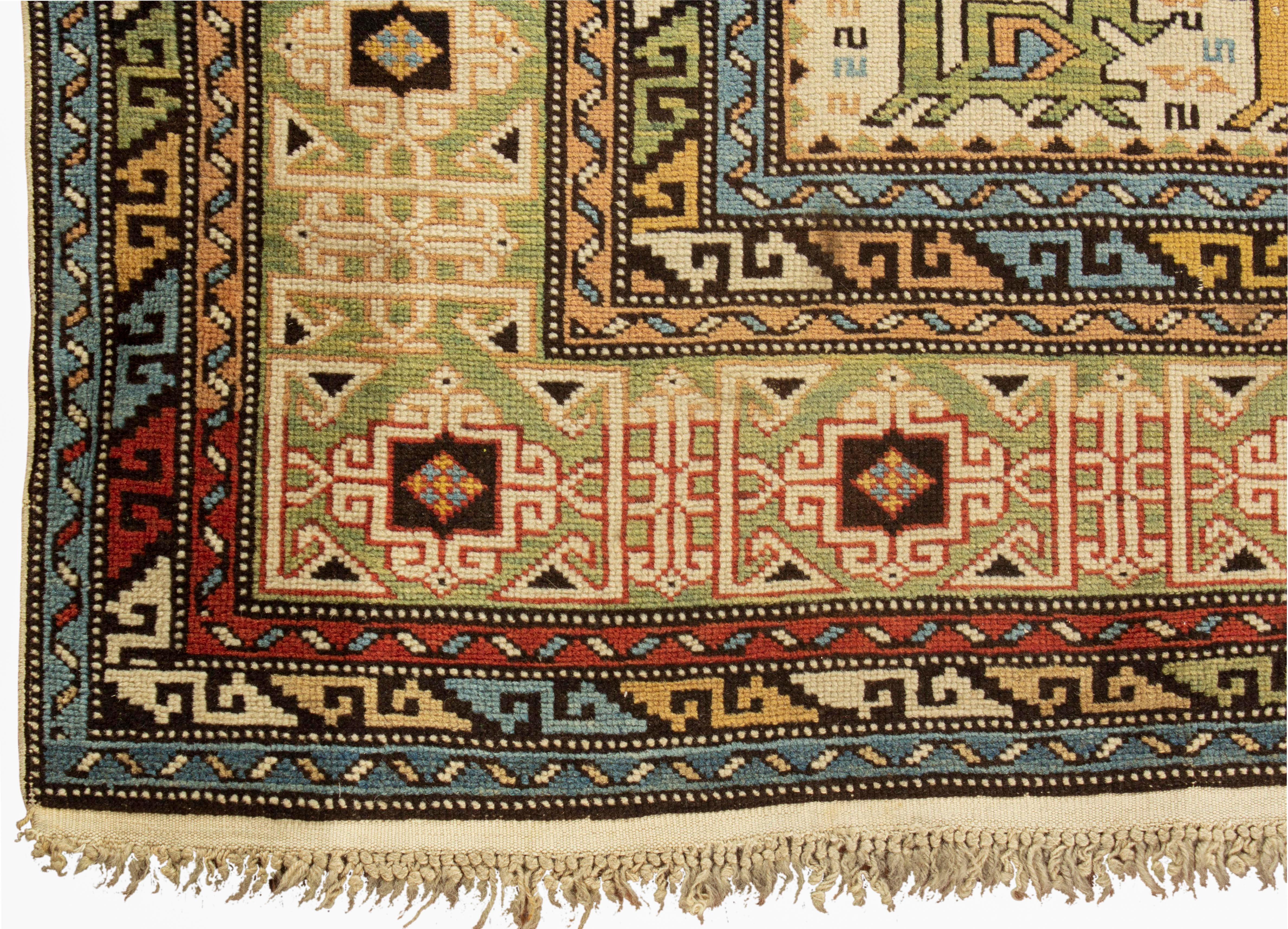 Antique Caucasian Perpedil Shirvan rug circa 1880 from the town of the same name situated to the southeast of Kuba in the Caucasian region of Daghestan. The main ivory field with the large Perpedil distinctive rams Horn design featured in soft blues