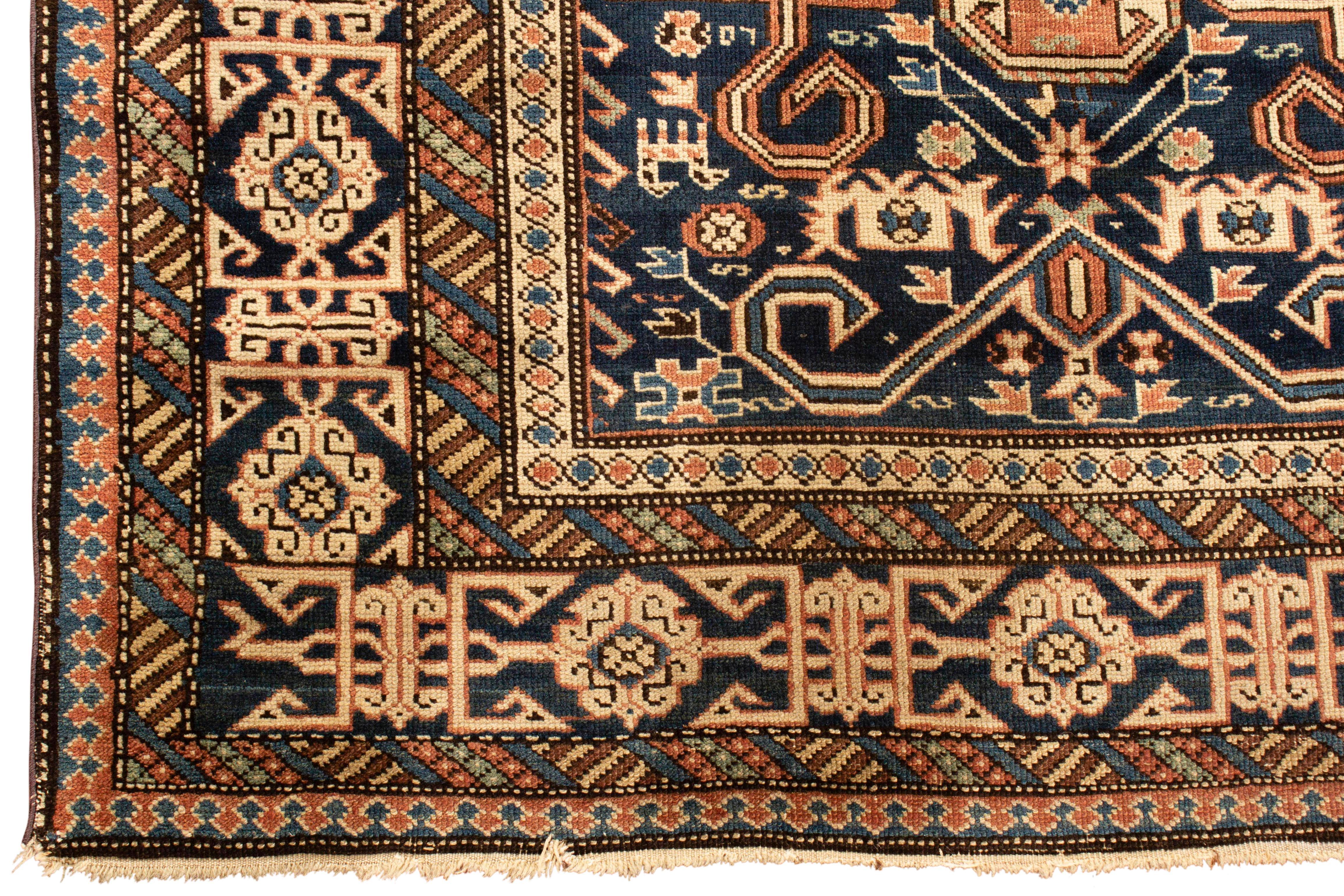Antique Caucasian Perpedil Shirvan rug circa 1880 from the town of the same name situated to the southeast of Kuba in the Caucasian region of Daghestan. Featuring the distinctive rams horn design associated with rugs from this area on a dark blue