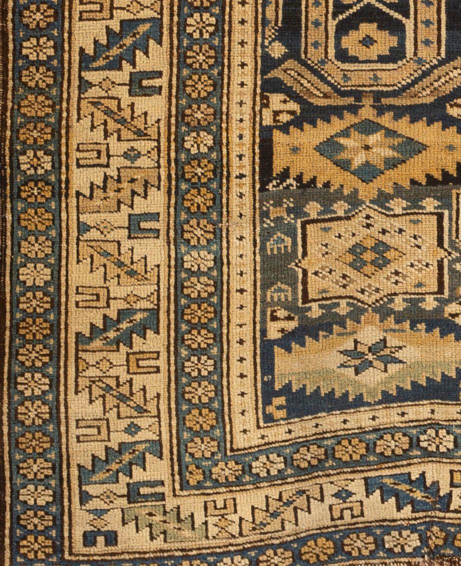 Antique Caucasian Perpedil Shirvan rug, circa 1880 from the town of the same name situated to the southeast of Kuba in the Caucasian region of Daghestan. Featuring the distinctive ram's horn design associated with rugs from this area on a dark blue