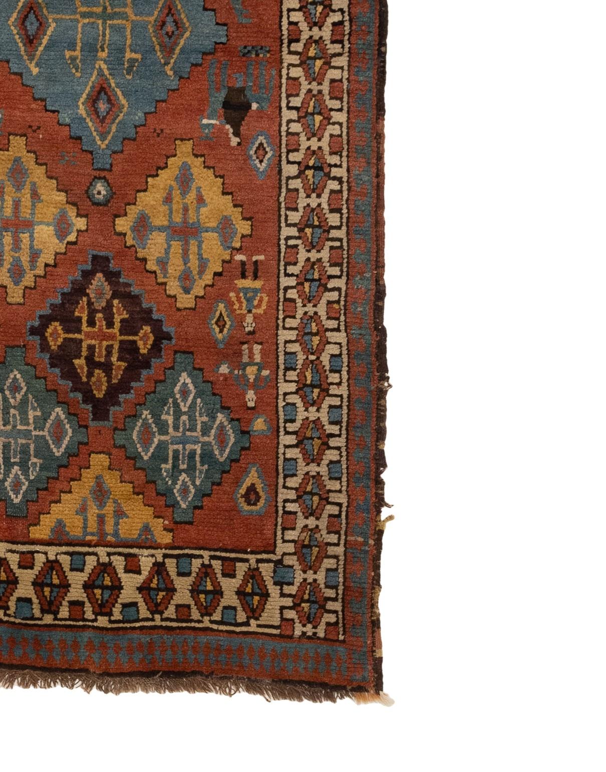 This is an Antique Caucasian Kazak from the 1880s featuring multicolored diamonds. Its intricate details are stunning, and it boasts a variety of geometric patterns in color schemes that range from earthy to vibrant. The Tribal Collection is perfect