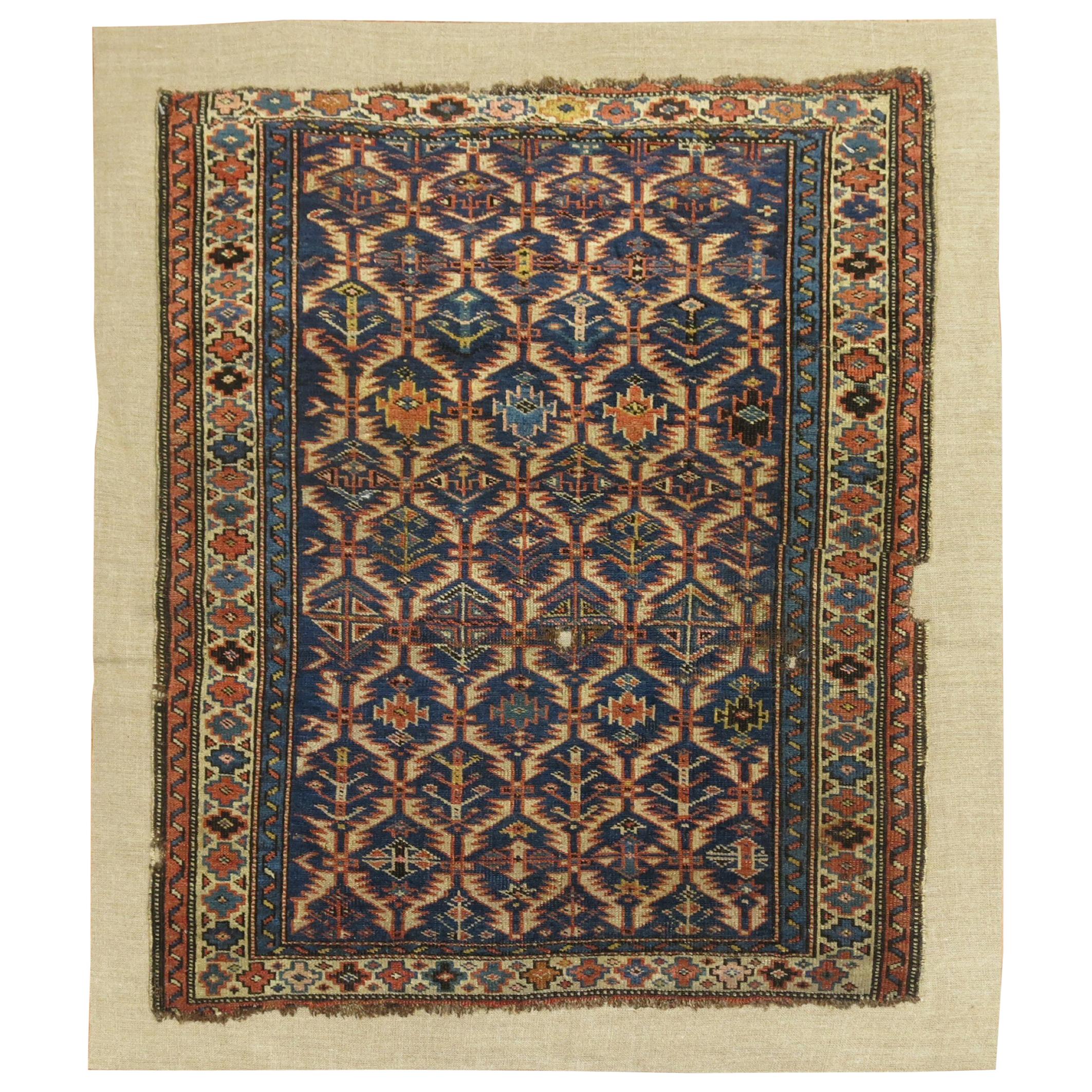 Antique Caucasian Rug Stitched on Linen For Sale