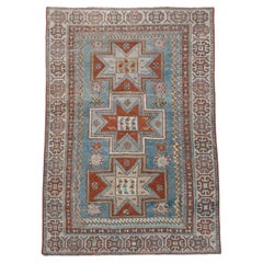 Antique Caucasian Rug with Star Medallions on Sky Blue Field, circa 1910s